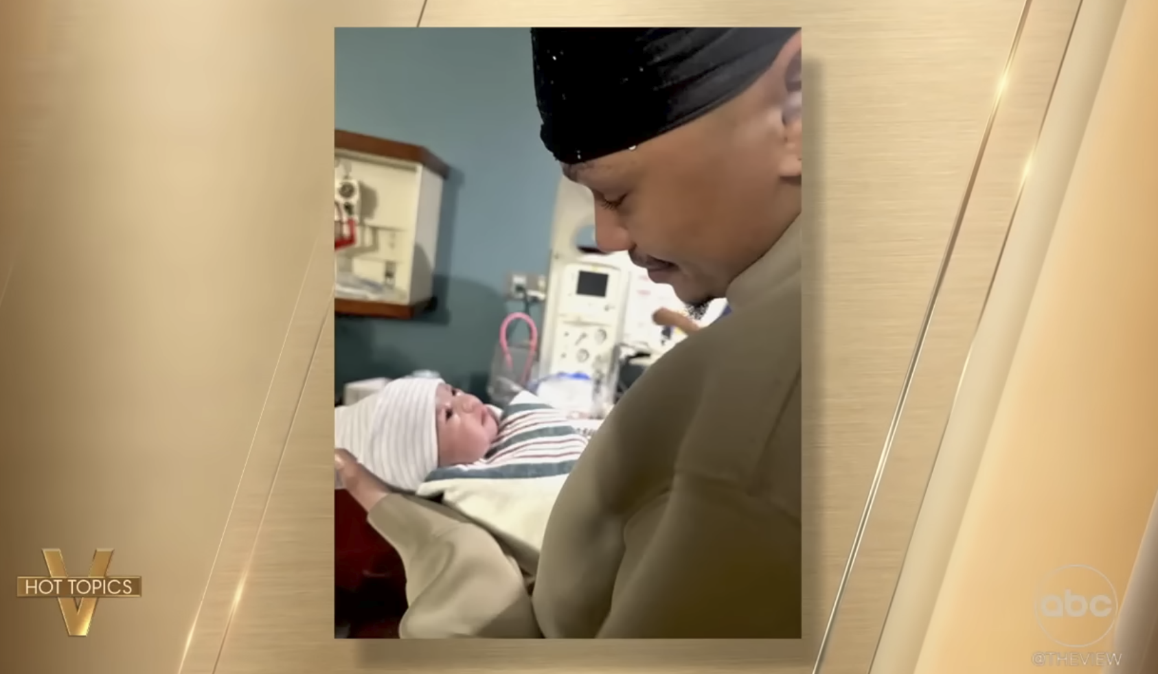 Baby Lotus is seen with her father, Mason Dean, in a video shared on December 8, 2025 | Source: YouTube/TheView