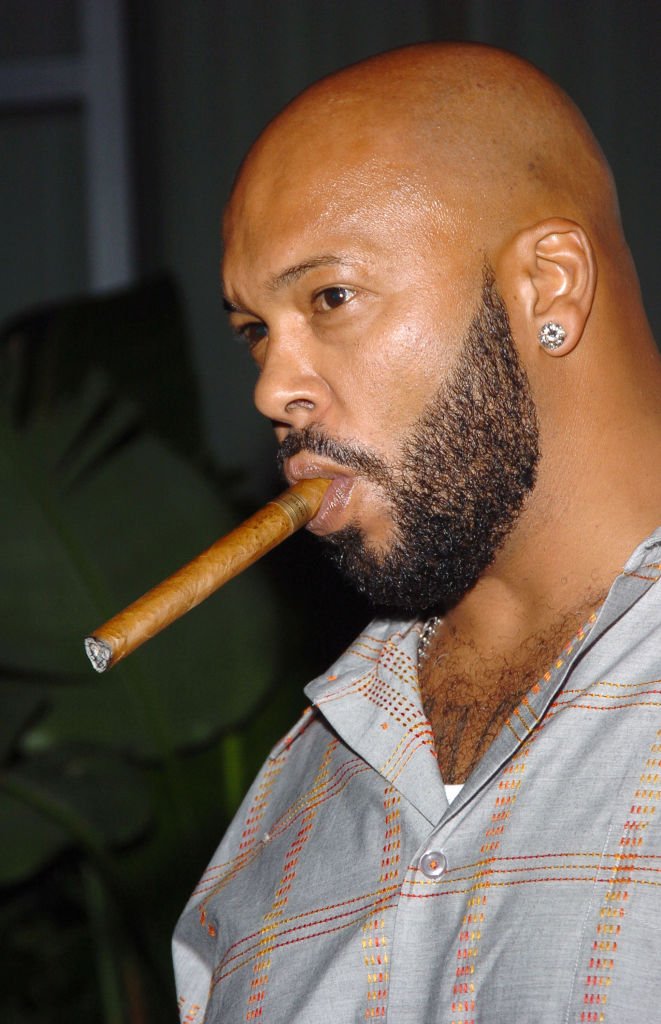 Suge Knight smokes a cigar at Kanye West's G.O.O.D. Music Party for 2005 MTV VMA at the Shoreclub in Miami Beach, Florida | Source: Getty Images (Photo by Lawrence Lucier/FilmMagic)
