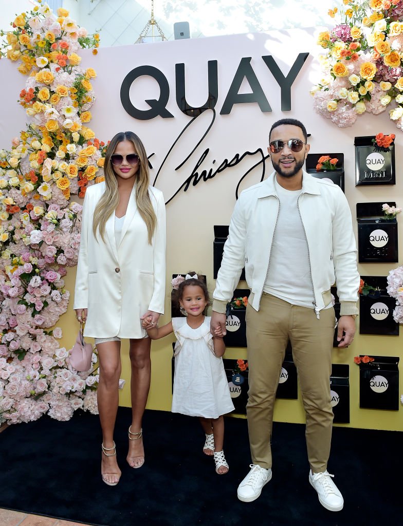 Chrissy Teigen and daughter Luna and John Legend attend QUAYXCHRISSY Launch Party at Olivetta| Photo: Getty Images