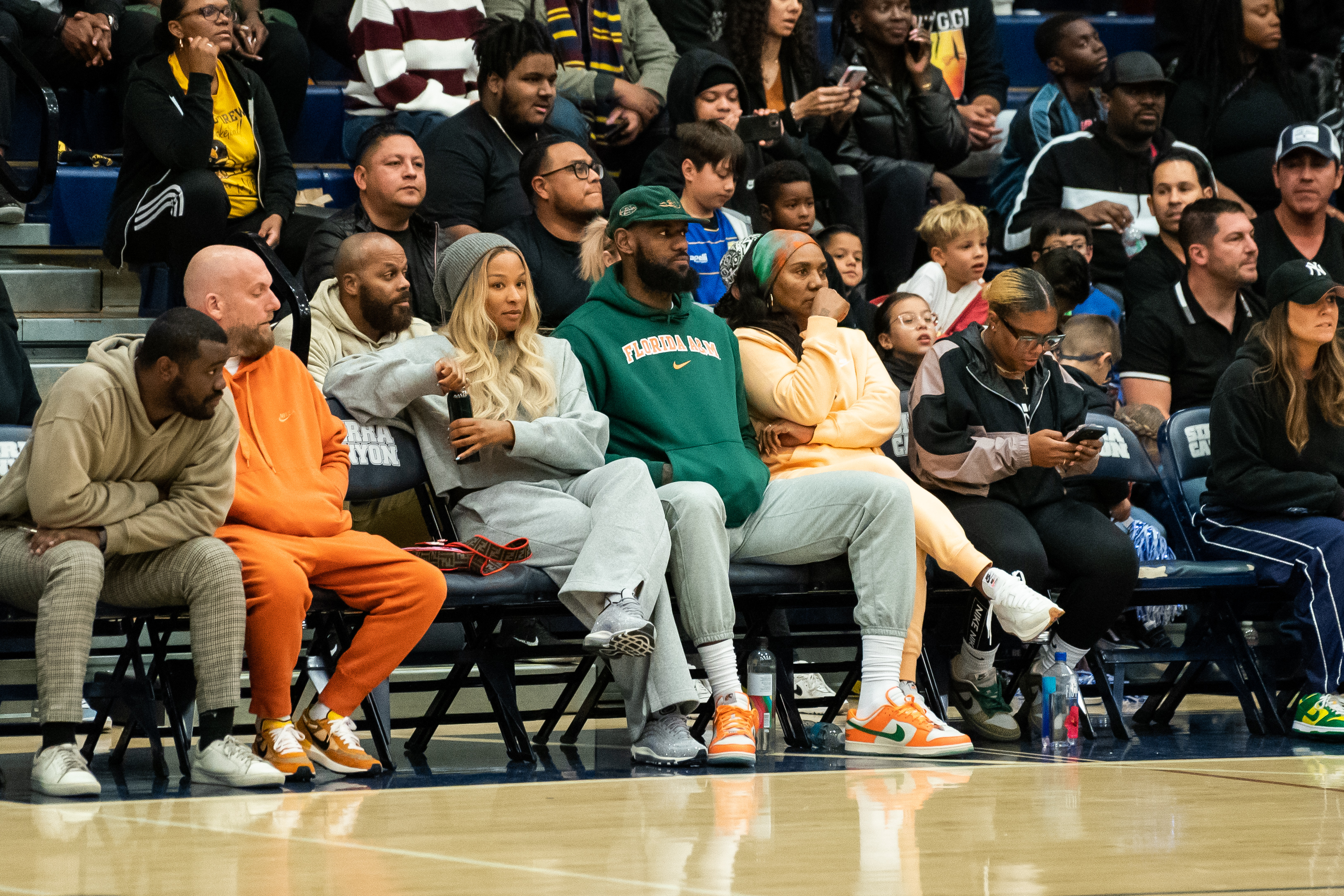 Savannah James, LeBron James, and Gloria James sit court side at the Sierra Canyon vs King Drew boys basketball game at Sierra Canyon High School on November 16, 2022, in Chatsworth, California | Source: Getty Images