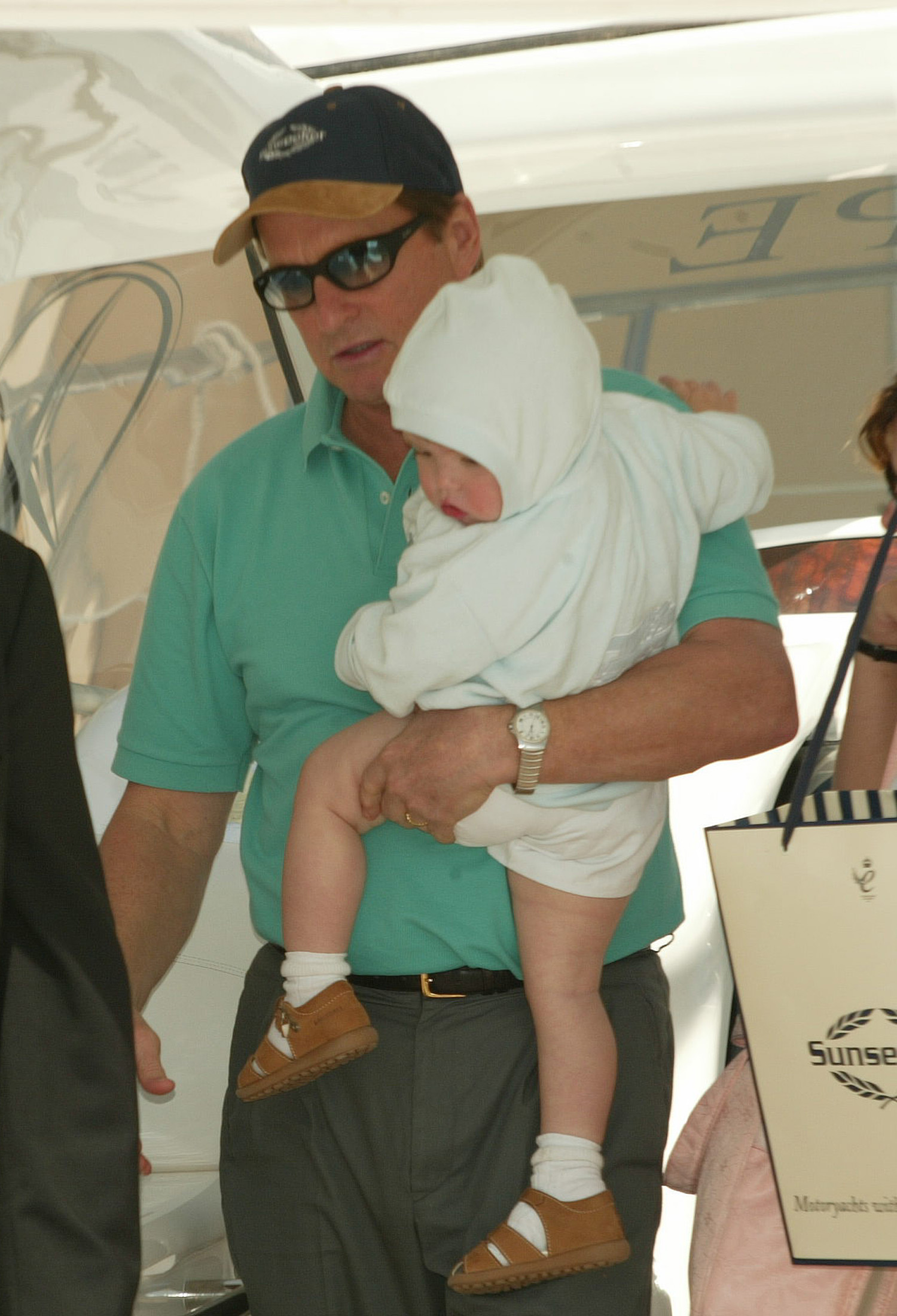 Michael Douglas and his son Dylan on boat at the Laureus Regatta in 2002 | Source: Getty Images