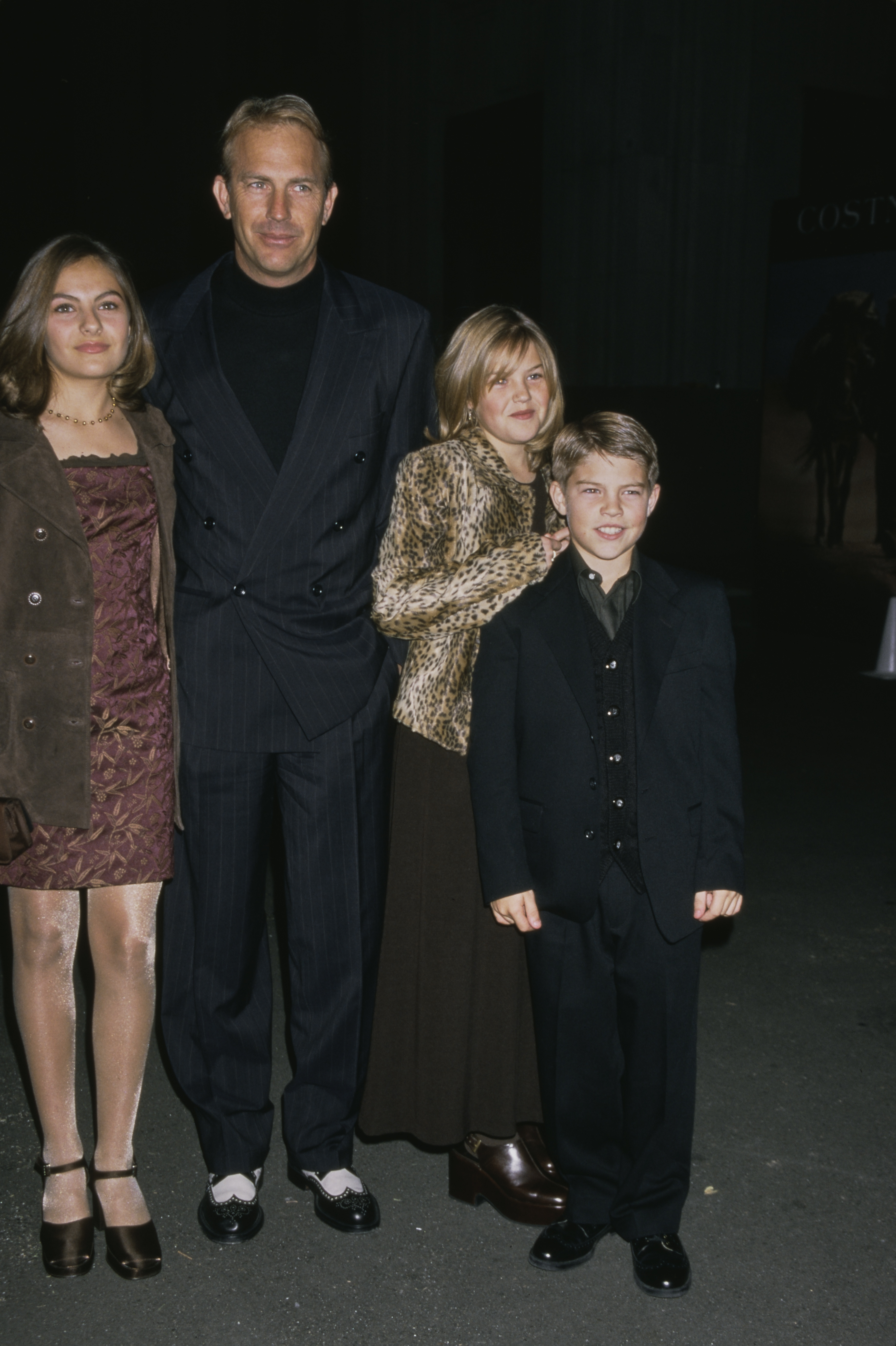 Kevin Costner with his children Lily, Annie, & Joe at "The Postman" premiere in Los Angeles in 1997 | Source: Getty Images