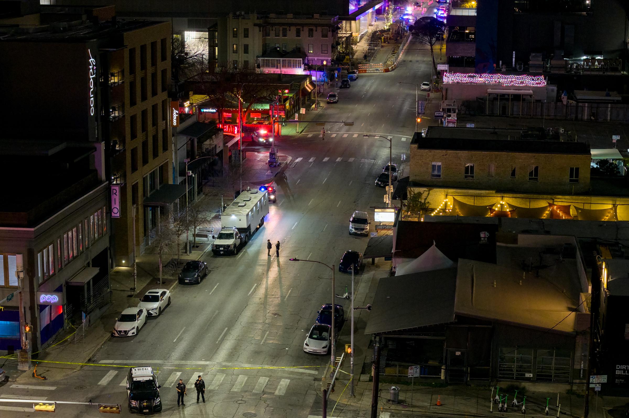 Law enforcement patrol an intersection near Buford's bar in downtown Austin on March 1, 2026. | Source: Getty Images