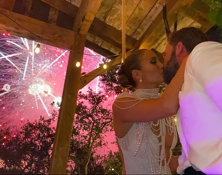Jennifer Lopez and Ben Affleck sharing a kiss posted on August 21, 2023 | Source: Instagram/jlo