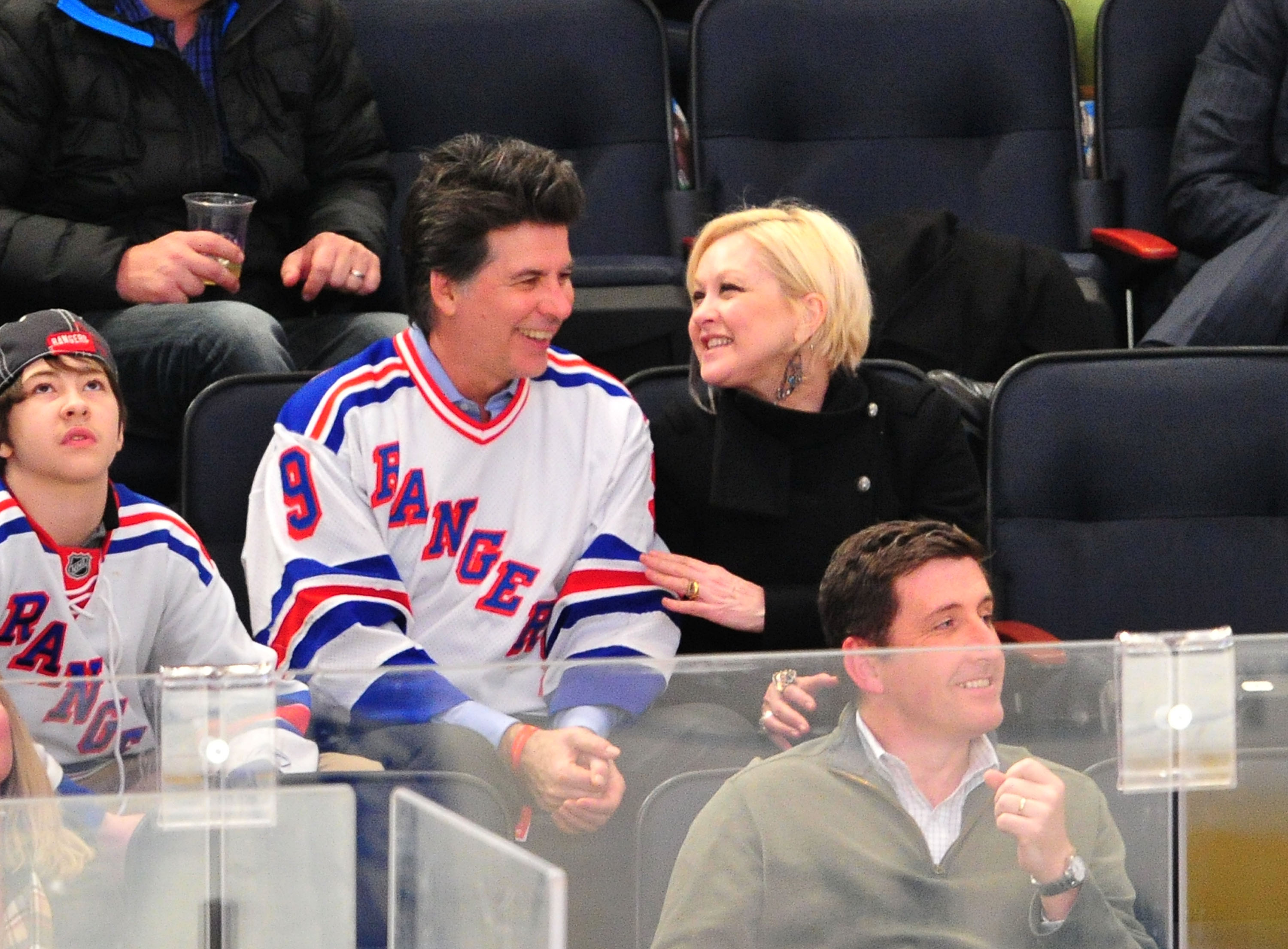 Declyn Wallace Thornton Lauper, David Thornton, and Cyndi Lauper at a game at Madison Square Garden on December 23, 2011, in New York City | Source: Getty Images
