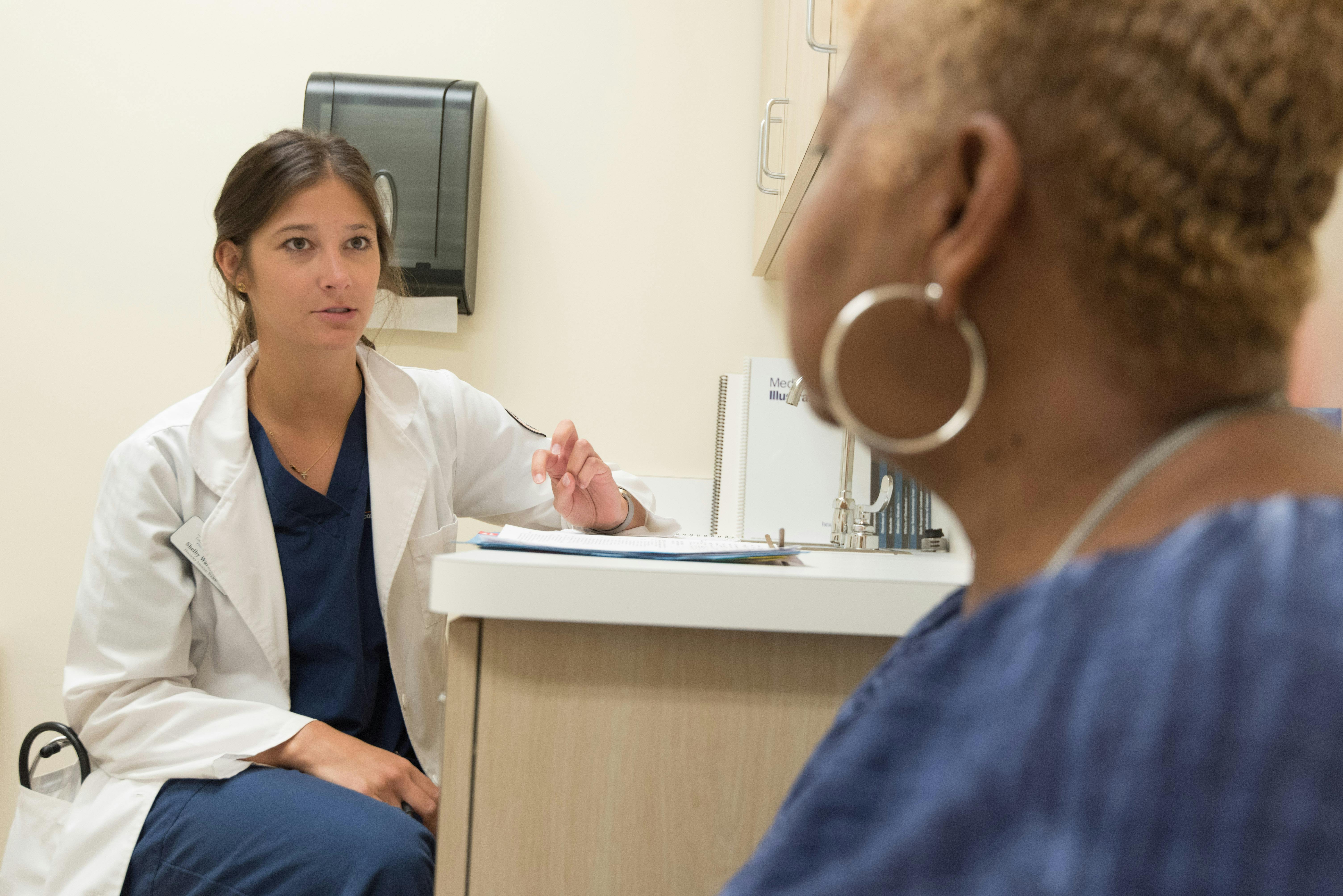 A woman listening to her doctor | Source: Pexels