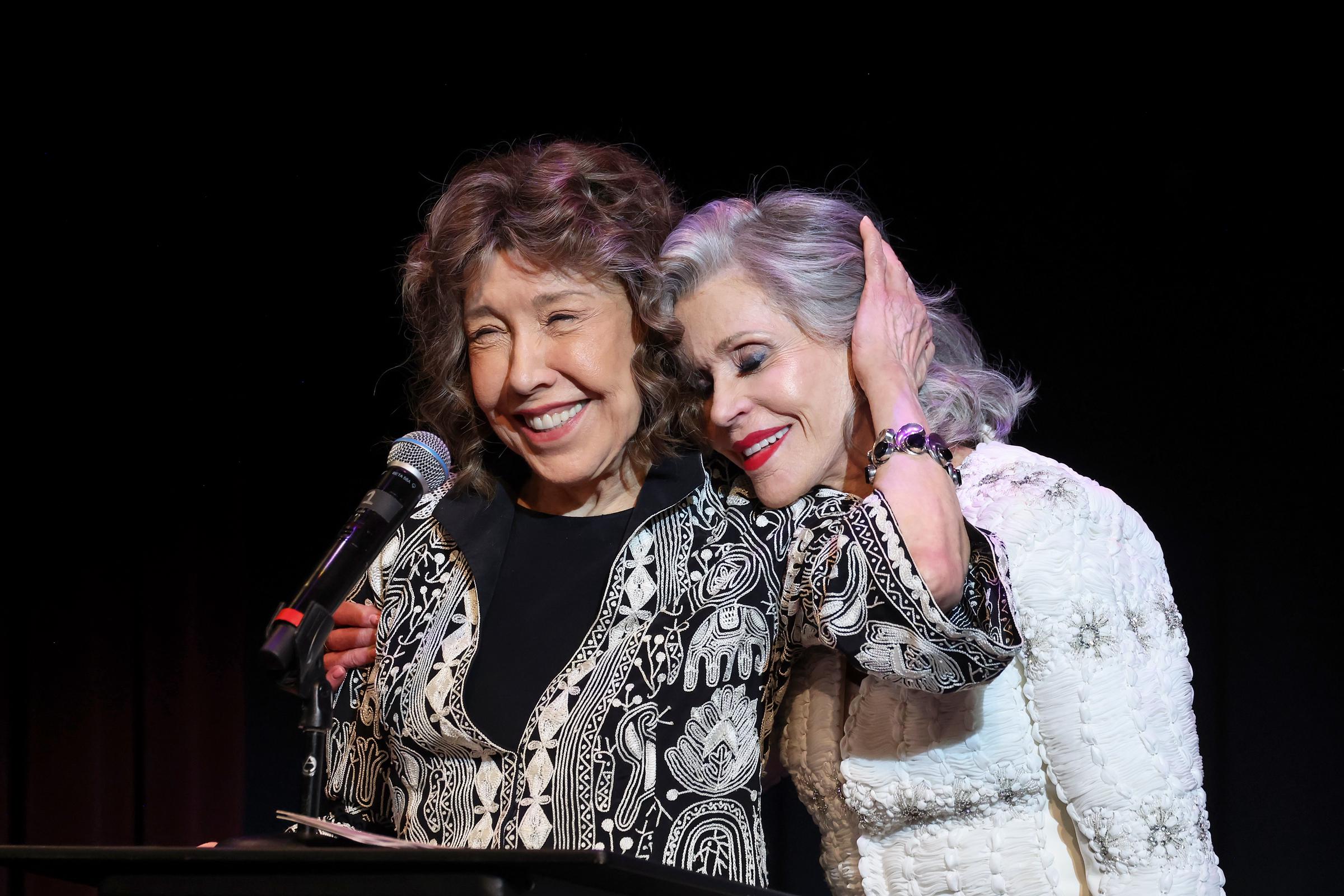 Lily Tomlin and Jane Fonda speak onstage during the Era Coalition Forward Women's Equality Trailblazer Awards and premiere of "Still Working 9 to 5" at Lily Tomlin/Jane Wagner Cultural Arts Center on May 29, 2024, in Los Angeles, California. | Source: Getty Images