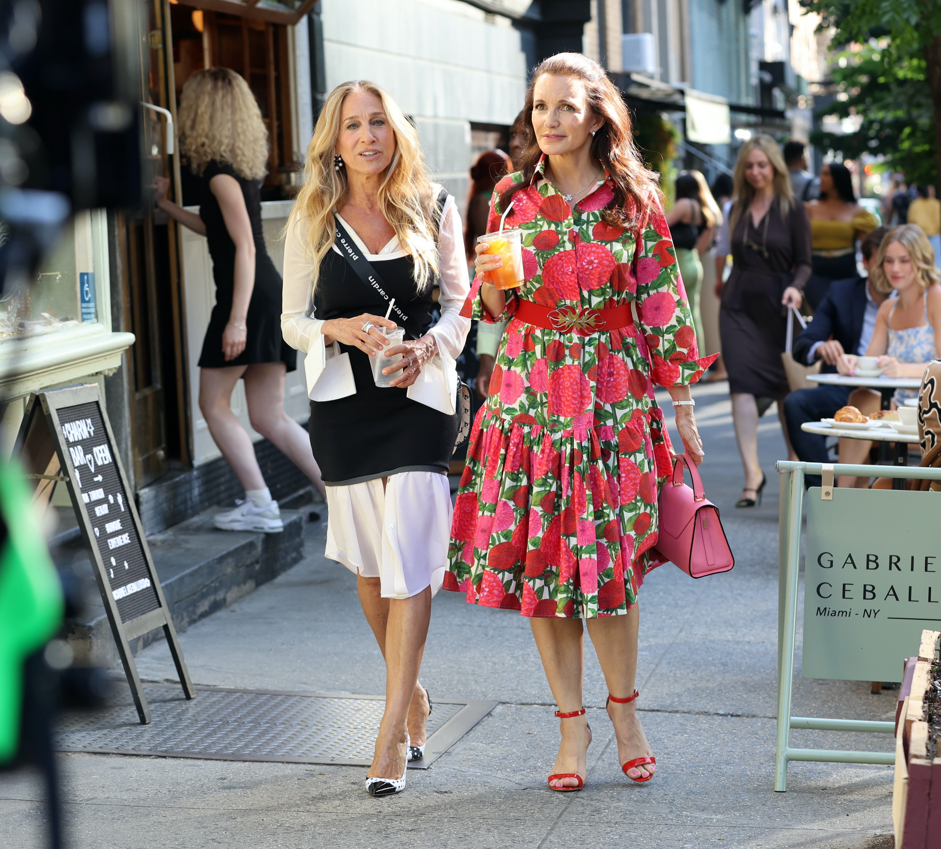 Sarah Jessica Parker and Kristin Davis on the set of "And Just Like That" set in Soho on June 25, 2024, in New York City. | Source: Getty Images