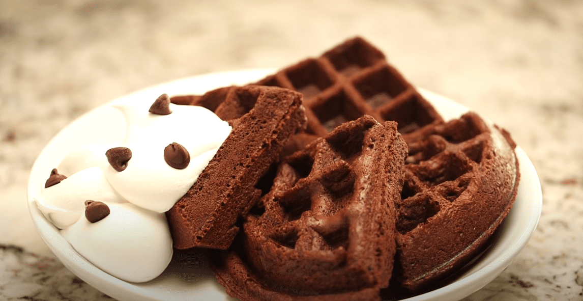 These brownie waffles are a fun take on waffles that you can even eat for dessert. | Photo: YouTube/Kelly Senyei