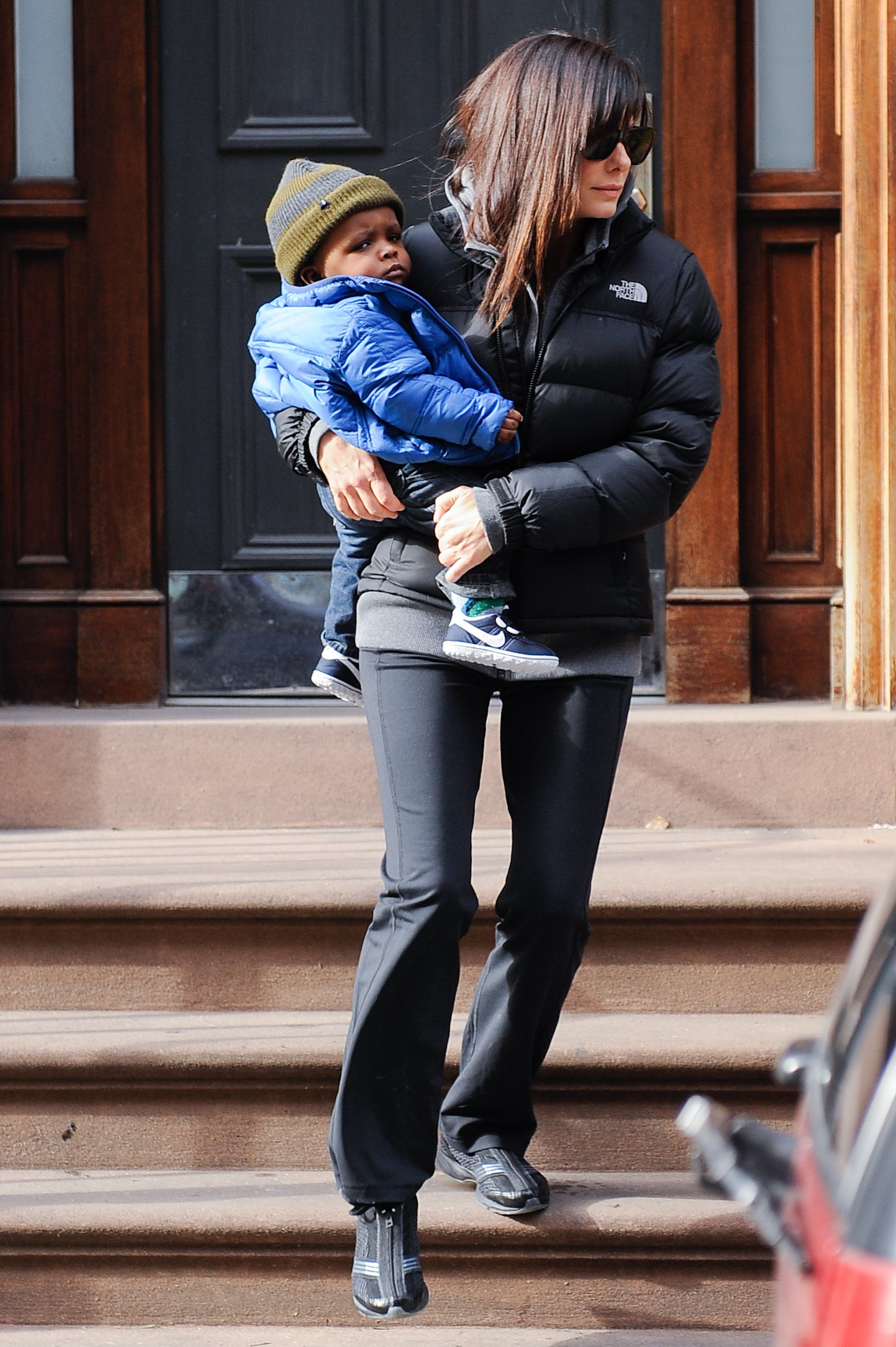 Sandra Bullock and her son Louis in New York City on January 20, 2011 | Source: Getty Images 