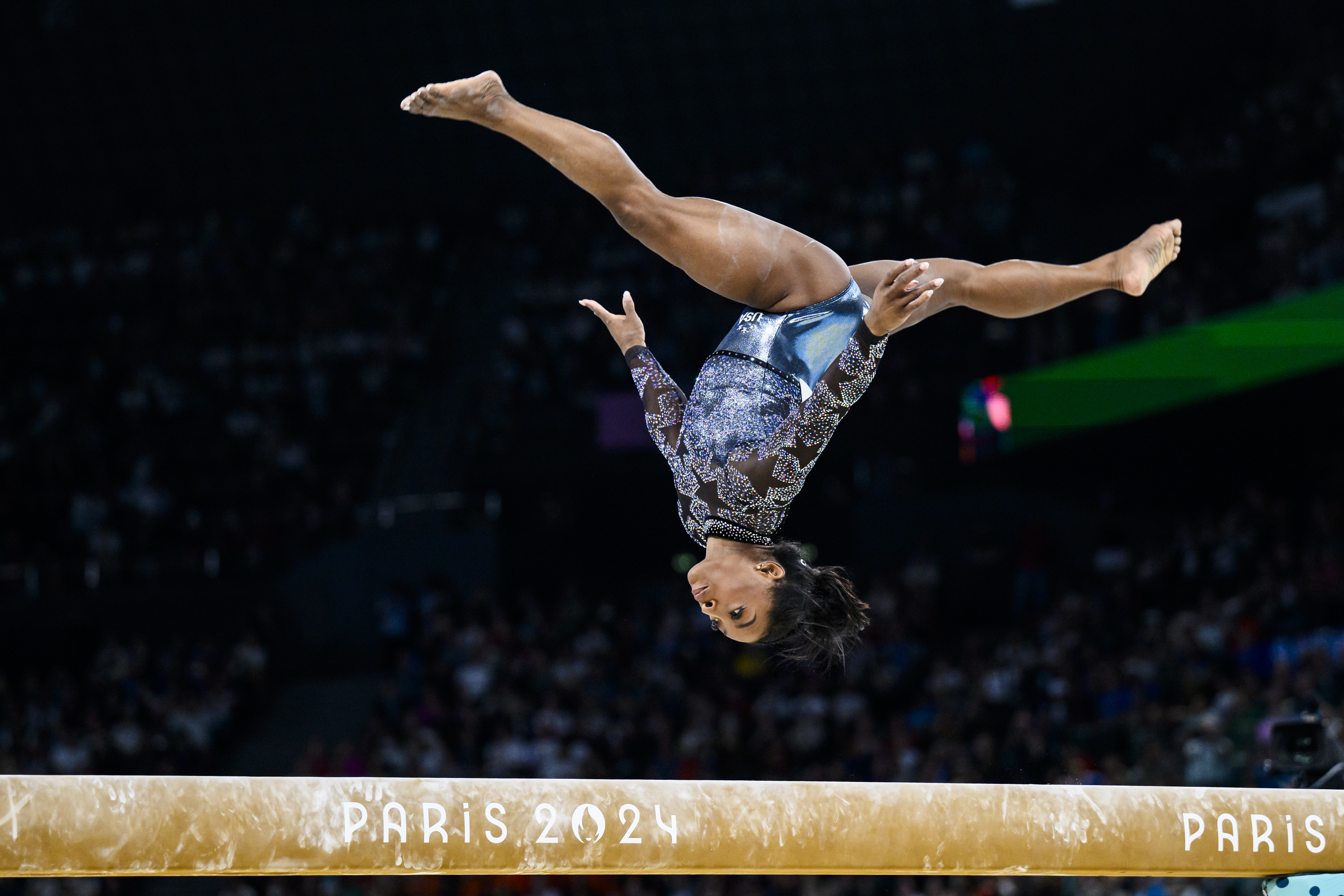 Simone Biles competes on the balance beam. | Source: Getty Images