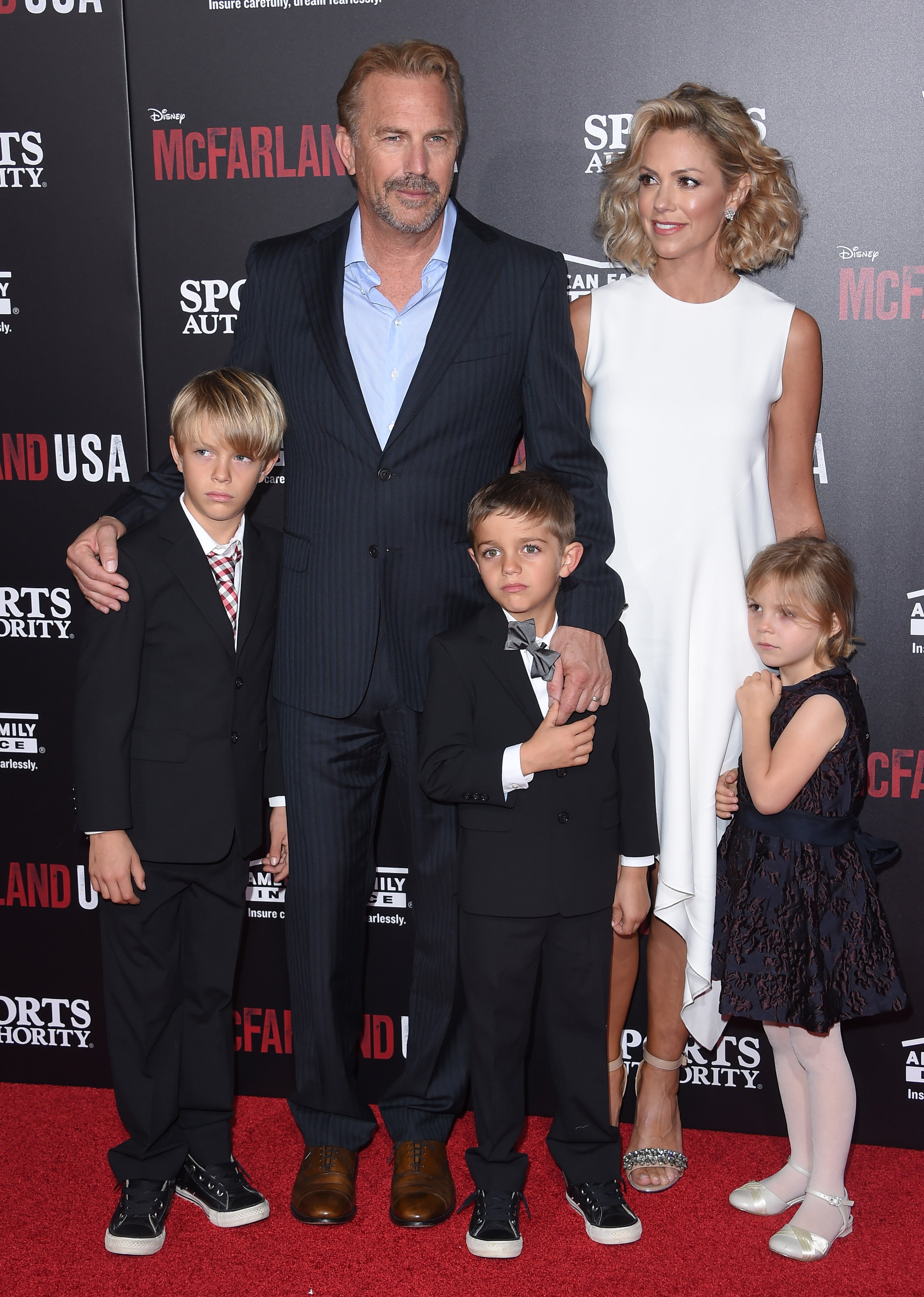Kevin Costner, his wife Christine Baumgartner, and their children Grace Avery, Hayes Logan, and Cayden Wyatt Costner at the world premiere of "McFarland, USA" on February 9, 2015, in Hollywood, California | Source: Getty Images