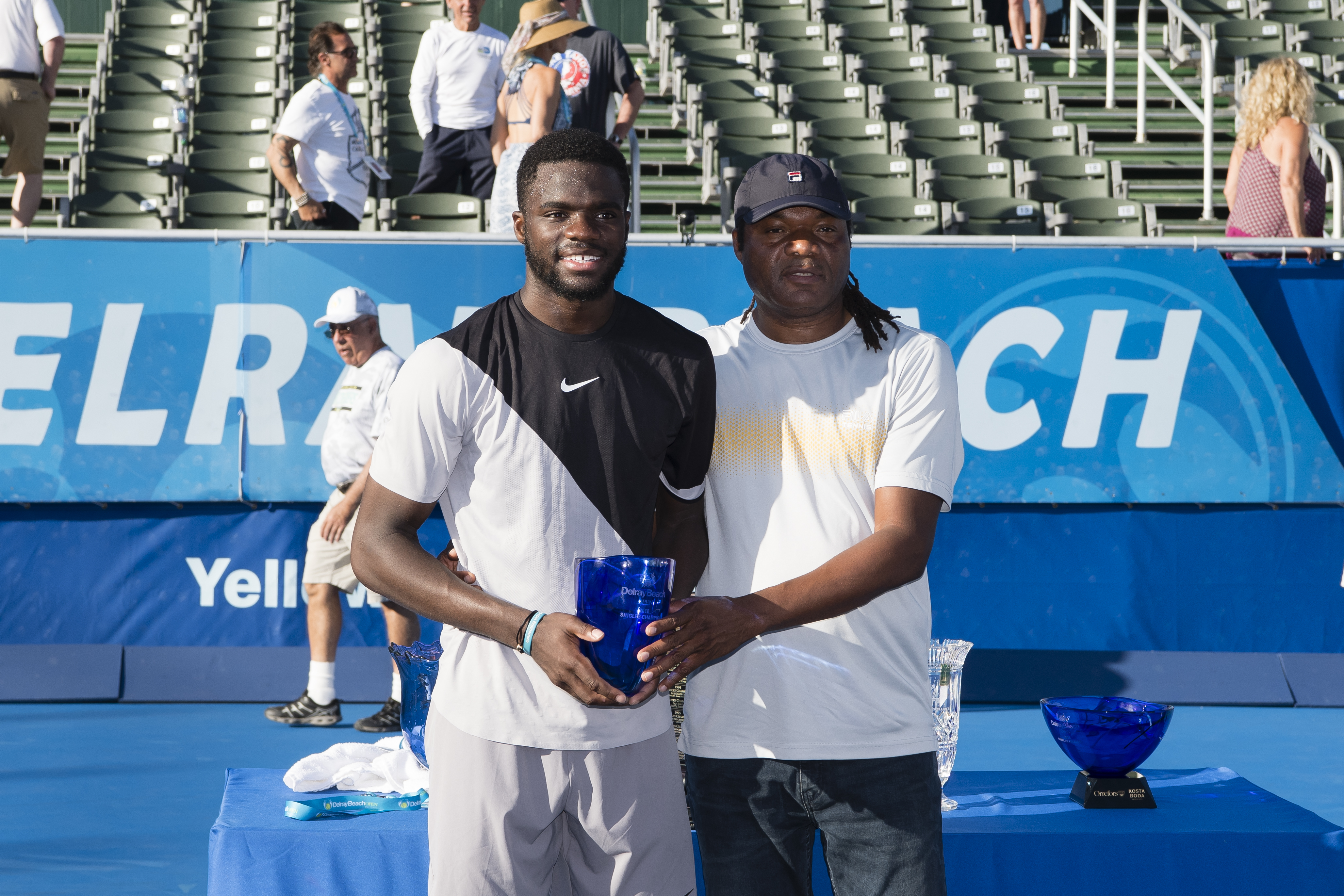 Championship winner Frances Tiafoe poses with his father, Constant Tiafoe, after his match with Peter Gojowczyk of Germany at the Delray Beach Open held at the Delray Beach Stadium & Tennis Center on February 25, 2018, in Delray Beach, Florida. | Source: Getty Images