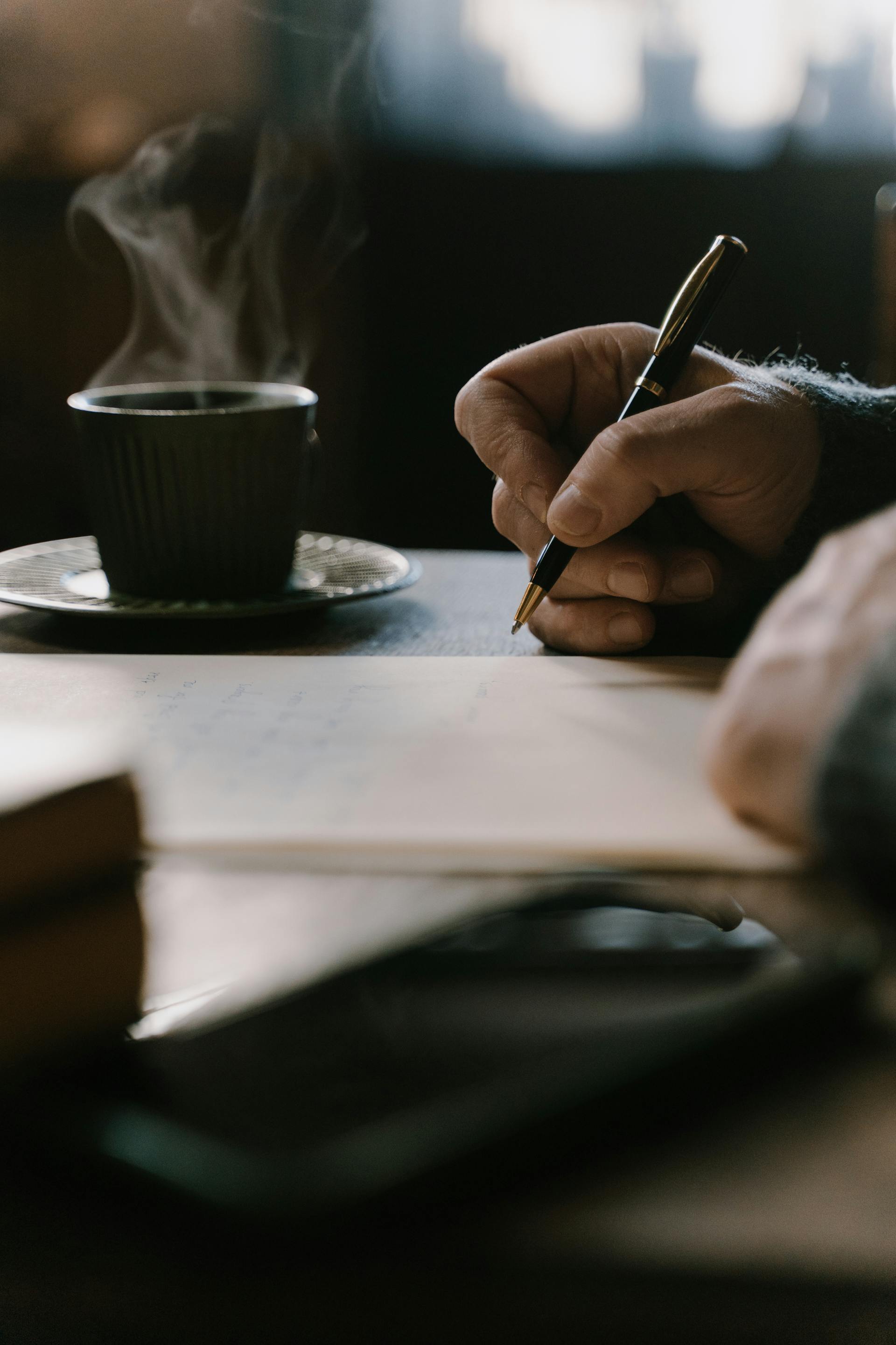 A person writing a letter | Source: Pexels
