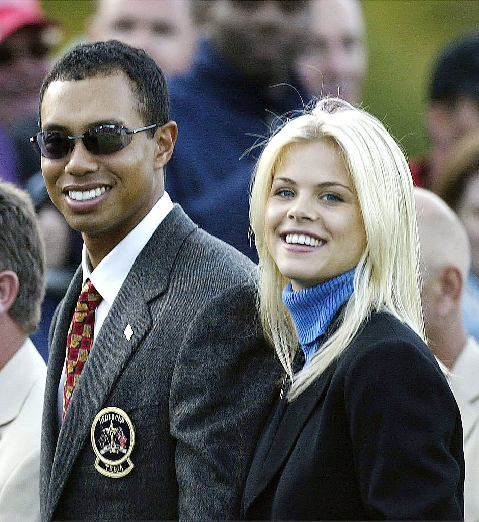 Golfer Tiger Woods poses with girlfriend Elin Nordegren during the opening Ceremony for the 34th Ryder Cup on September 26, 2002 in Sutton Coldfield, England. | Source: Getty Images