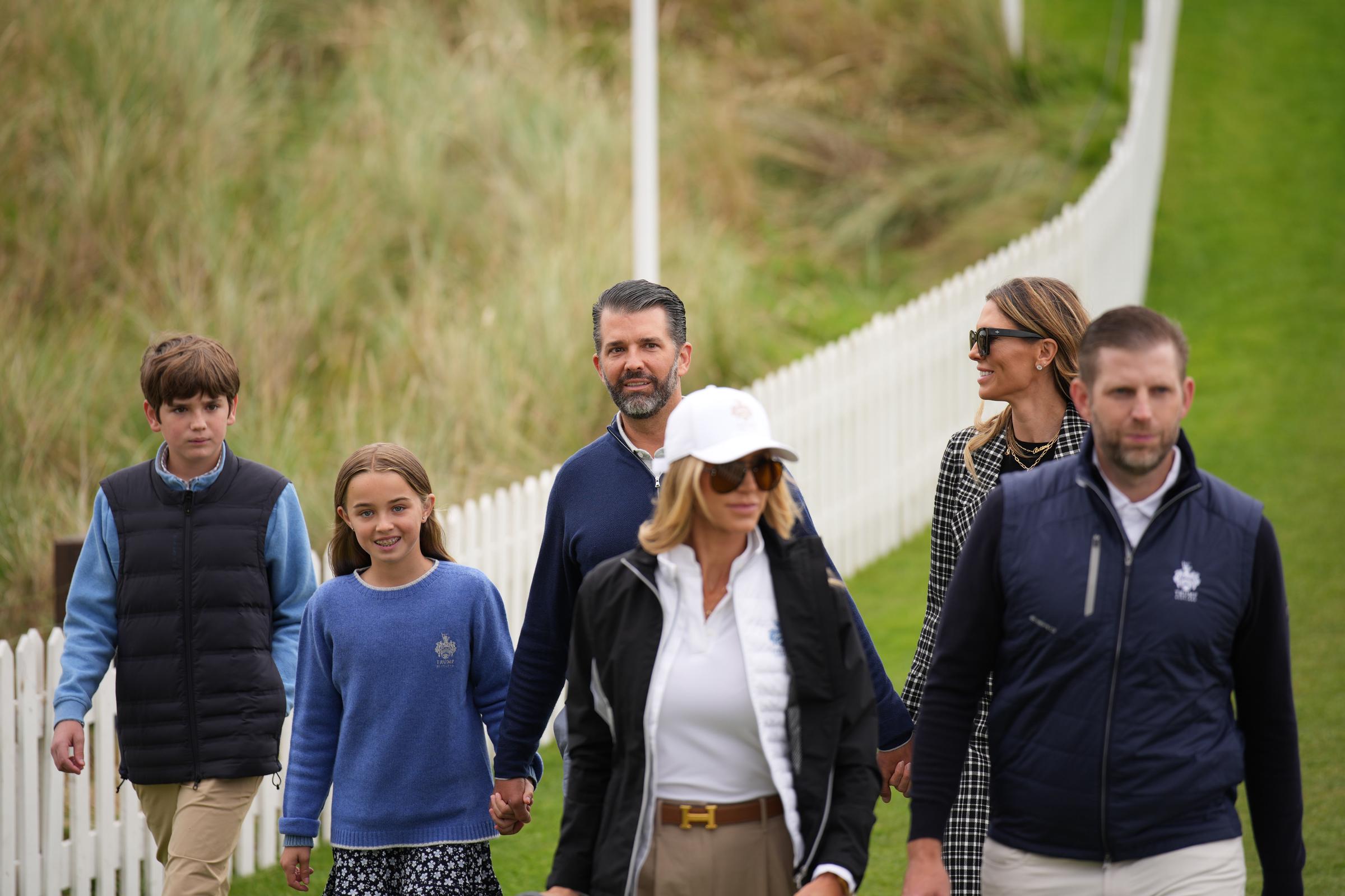 Eric Trump and Lara Trump (front) and Donald Trump Jr. and partner Bettina Anderson (back) and family on July 29, 2025, in Balmedie, near Aberdeen, Scotland | Source: Getty Images