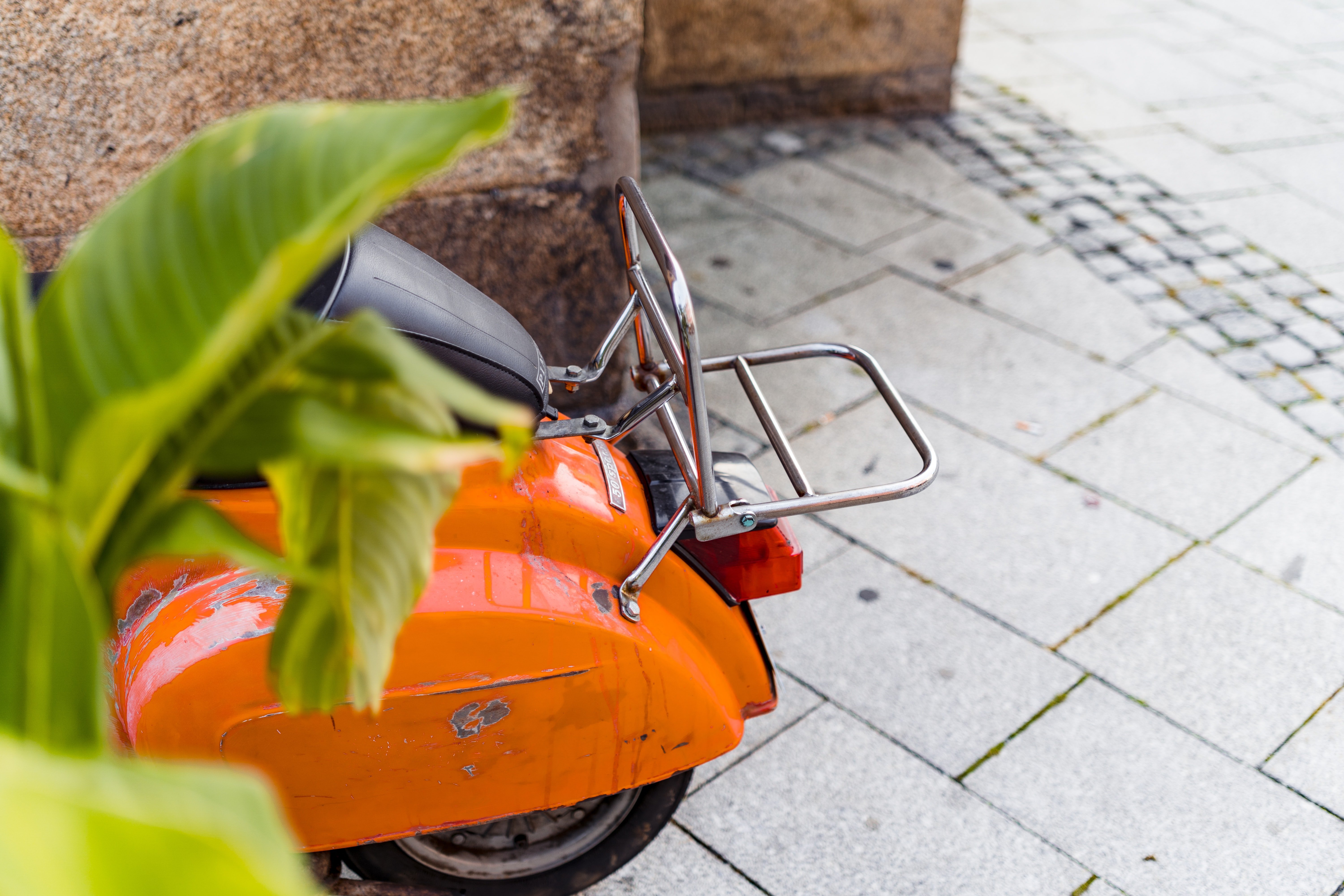 When Paul saw Stephen struggling to park the scooter, he helped him. | Source: Unsplash