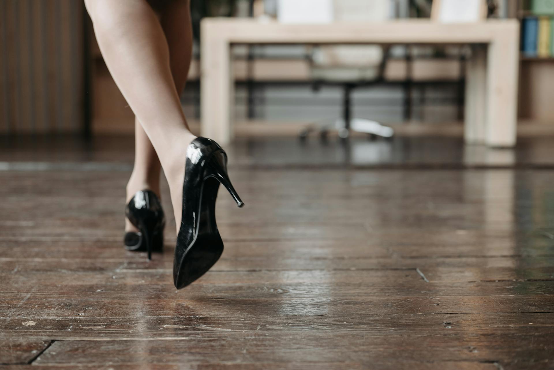 Close-up of a woman wearing black heels walking away | Source: Pexels