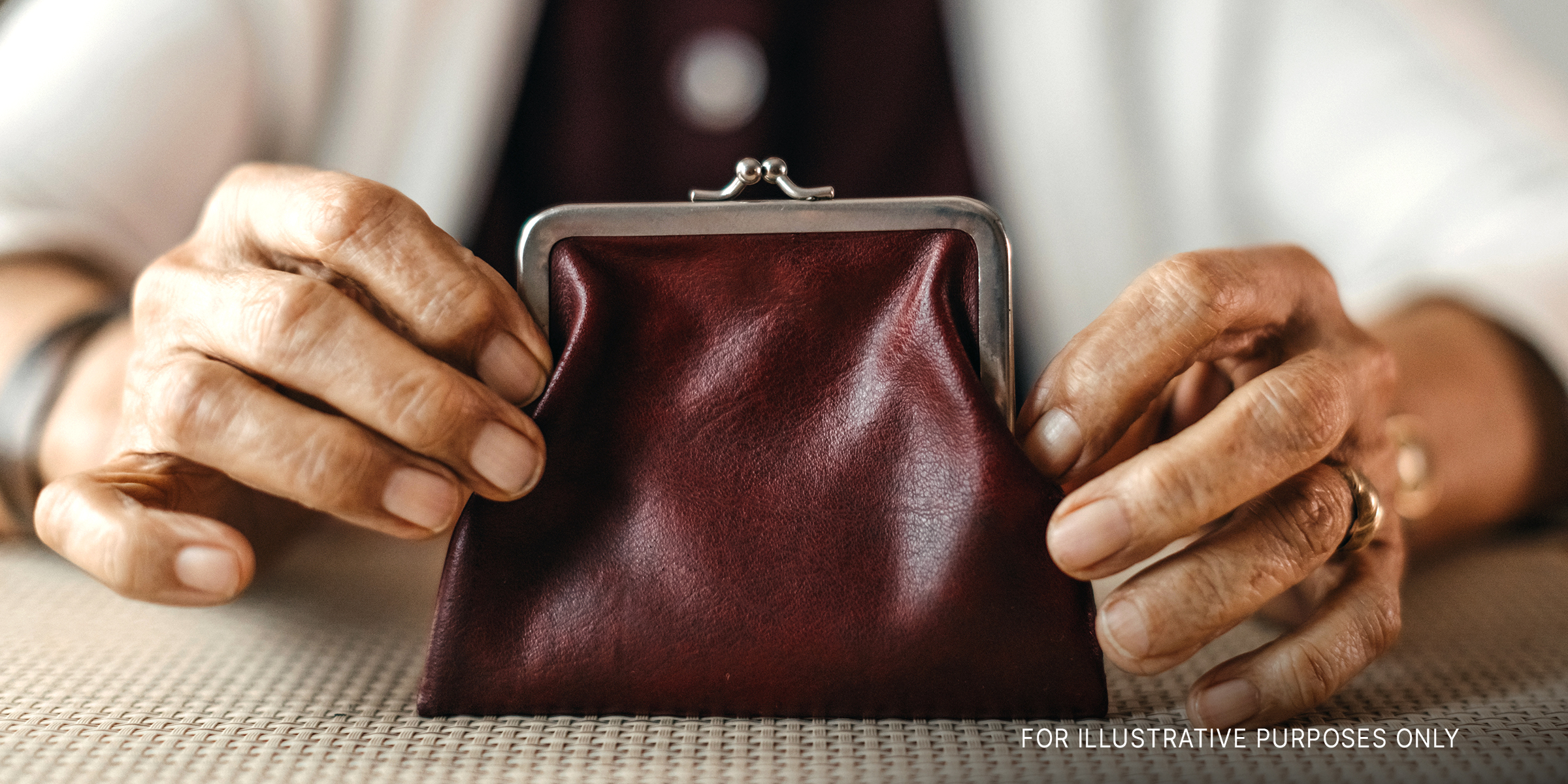 Woman holding a wallet | Source: Getty Images