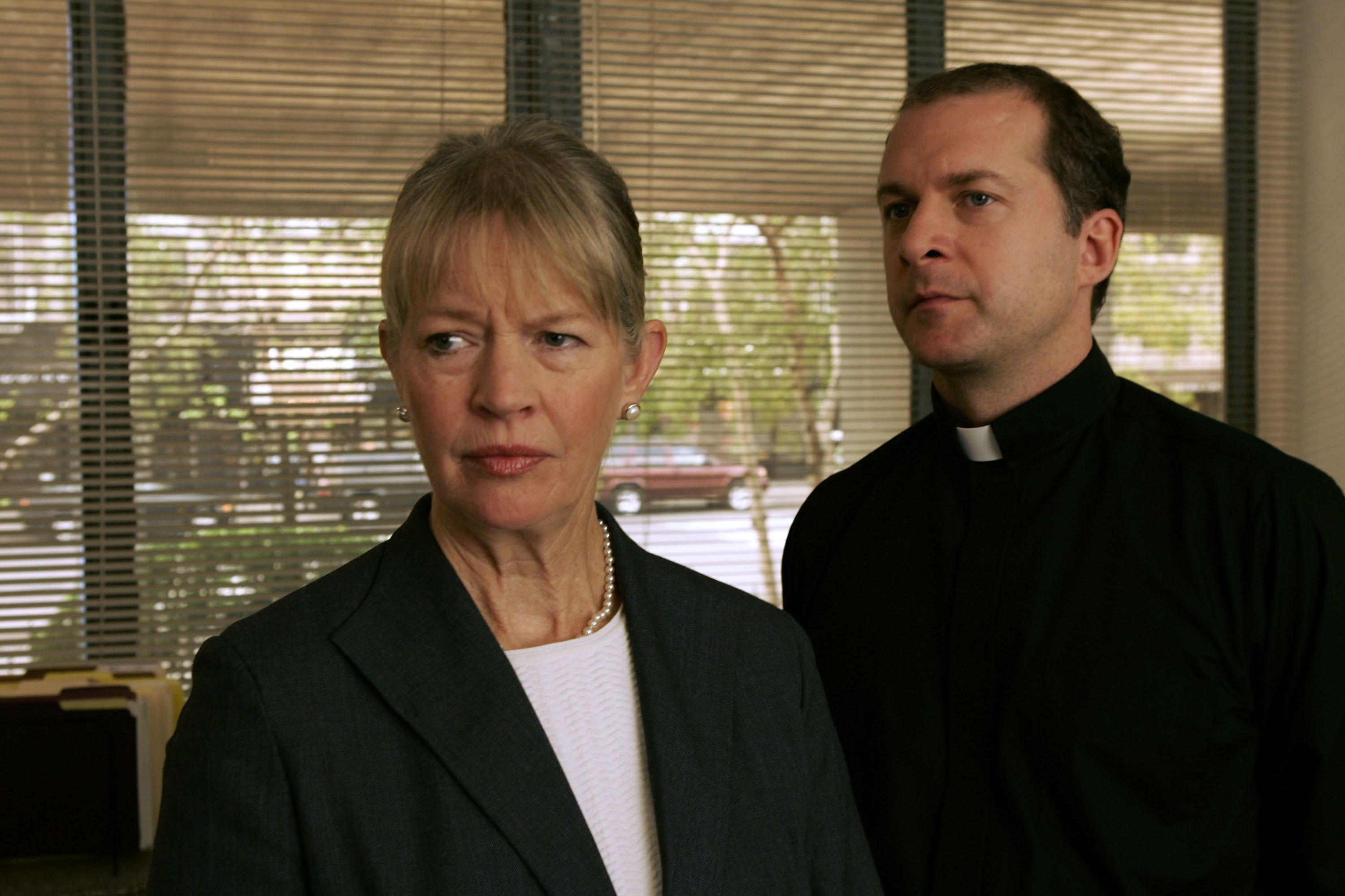 Dorothy Lyman as Principal Parker and Daniel Jenkins as Father Justin Miller on "Law & Order: Special Victims Unit" on October 24, 2005 | Source: Getty Images