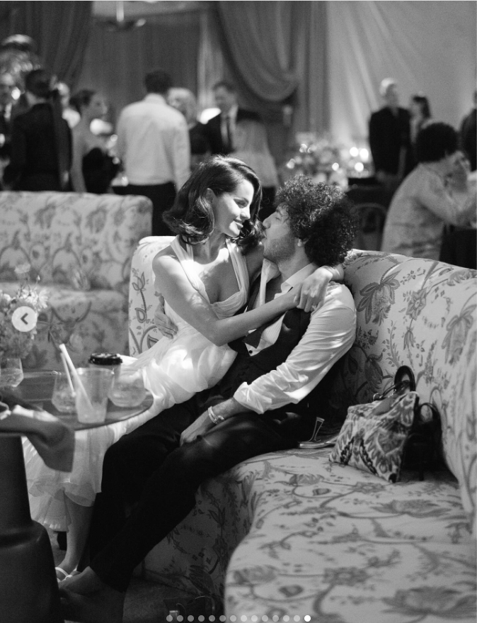 Selena Gomez and Benny Blanco are seated on a sofa on their wedding day, from a post dated September 30, 2025 | Source: Instagram/selenagomez