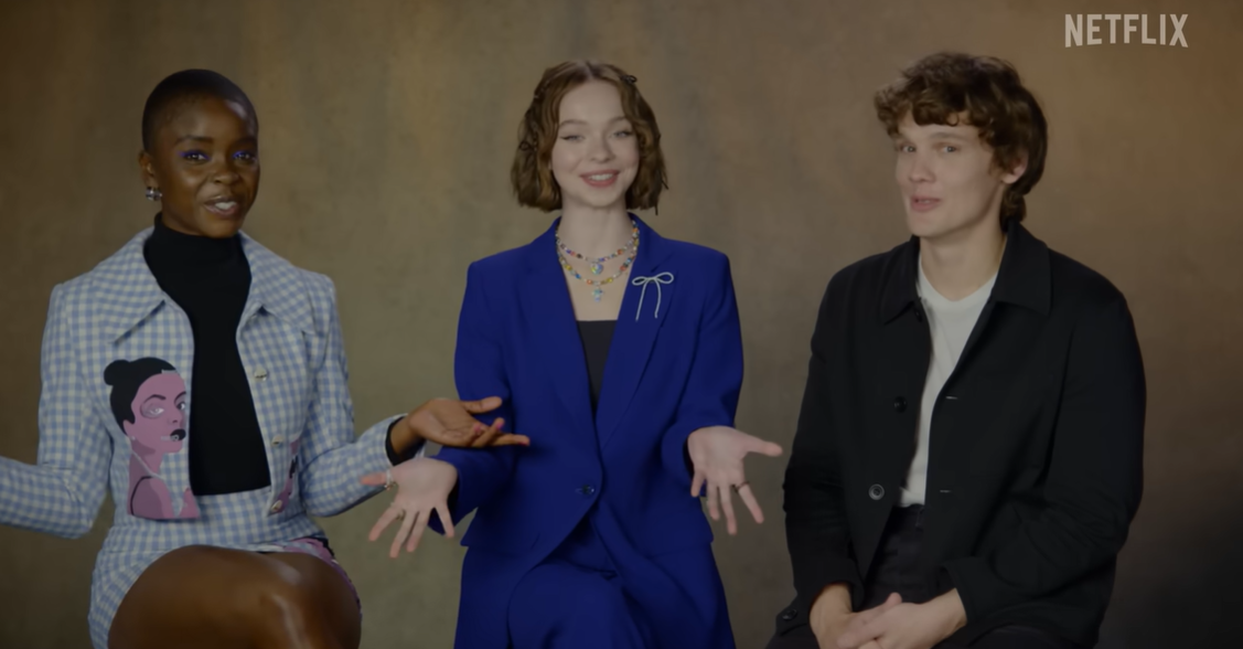 A June 2023 promotional video featured Joy Sunday, Emma Myers, and Hunter Doohan discussing the addition of a mysterious new cast member to "Wednesday." | Source: Youtube/Netflix