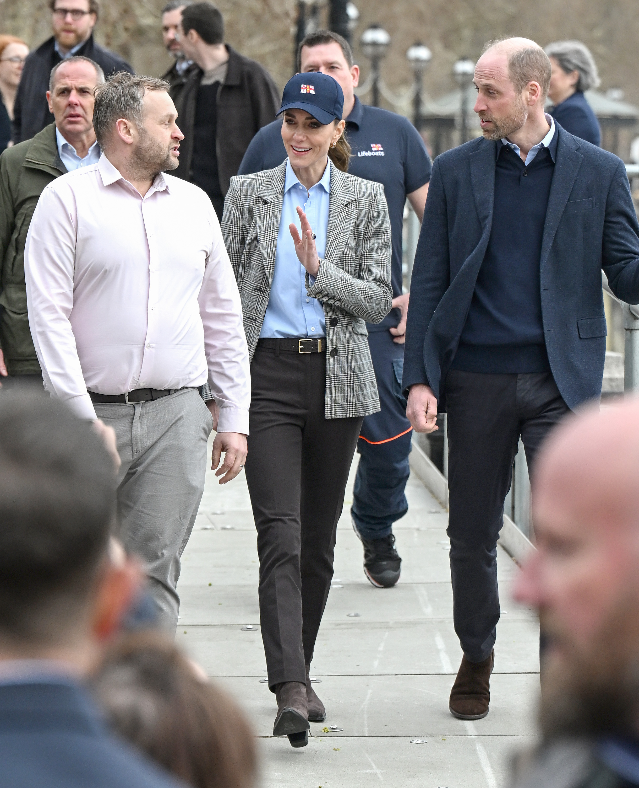 Catherine, Princess of Wales waves to well-wishers as she and Prince William, Prince of Wales walk along the riverside during their visit to the RNLI Tower Station on 12 March 2026 in London, England. | Source: Getty Images