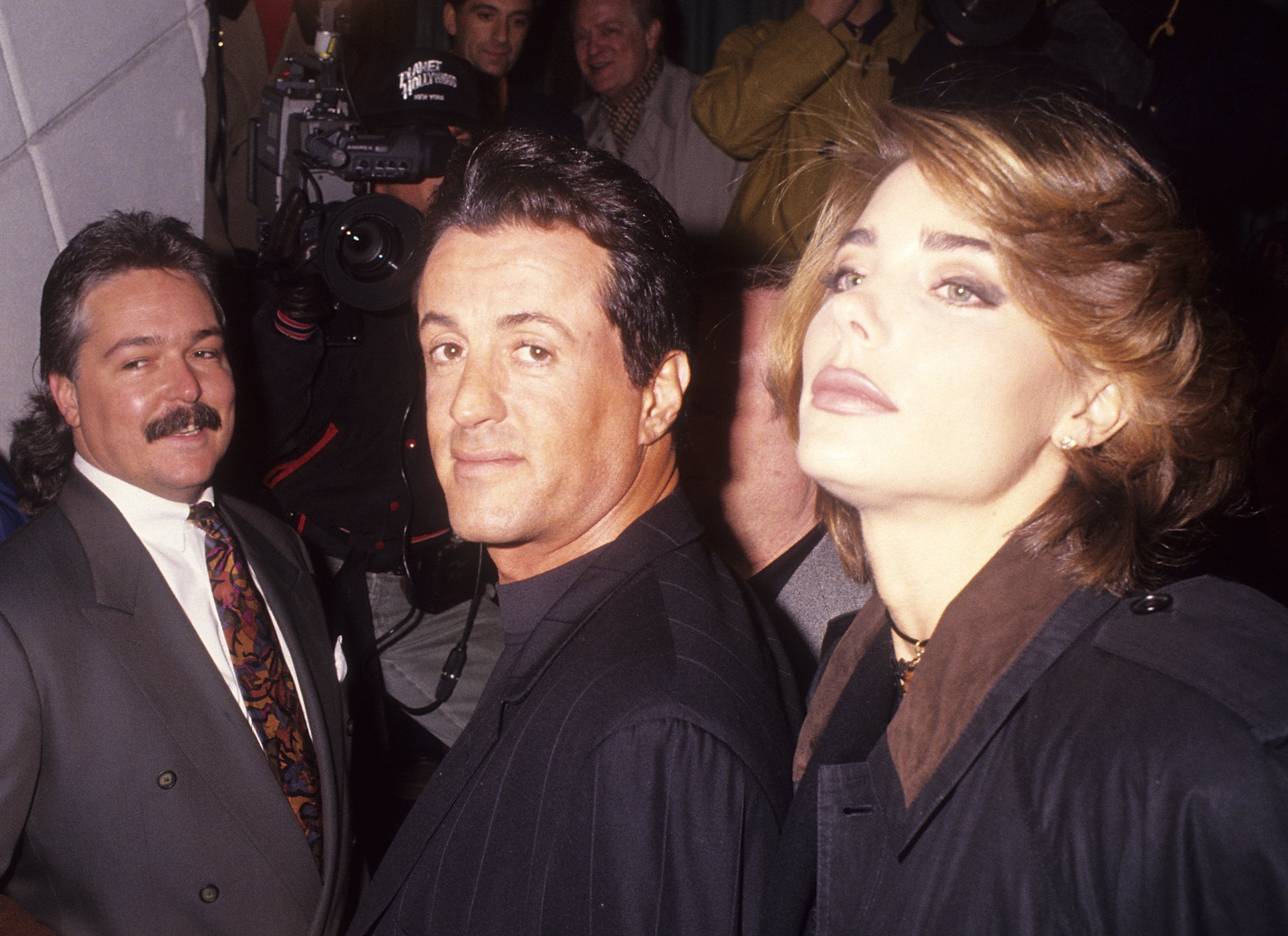 Sylvester Stallone and girlfriend Jennifer Flavin attending "Kiss AIDS Goodbye" Hollywood's Famous Kisses Display and Auction at Planet Hollywood 140 West 57th Street on February 10, 1992 in New York City. | Source: Getty Images