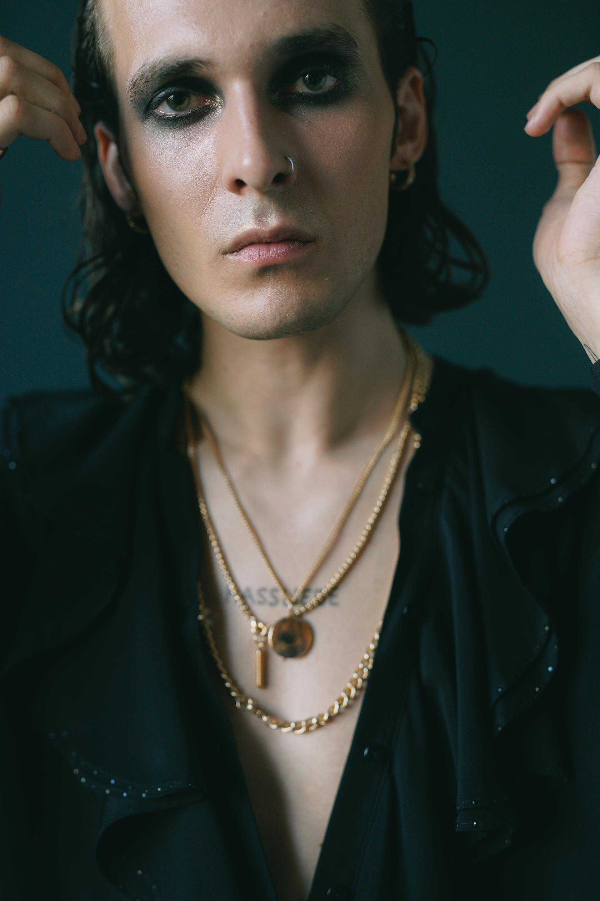 A man wearing makeup looking at the camera | Source: Pexels