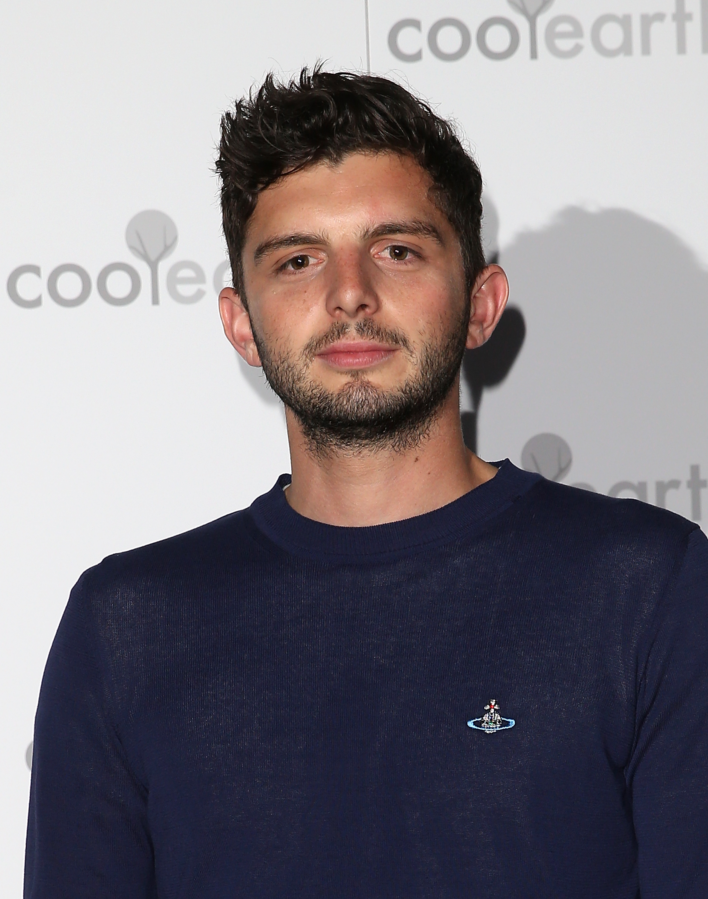 Michael Fox attended the 2015 launch party for Cool Earth in London with a youthful, laid-back style. Wearing a simple navy crewneck and sporting a short, tousled haircut, he struck a casual figure far removed from the footman he would later portray on "Downton Abbey."
