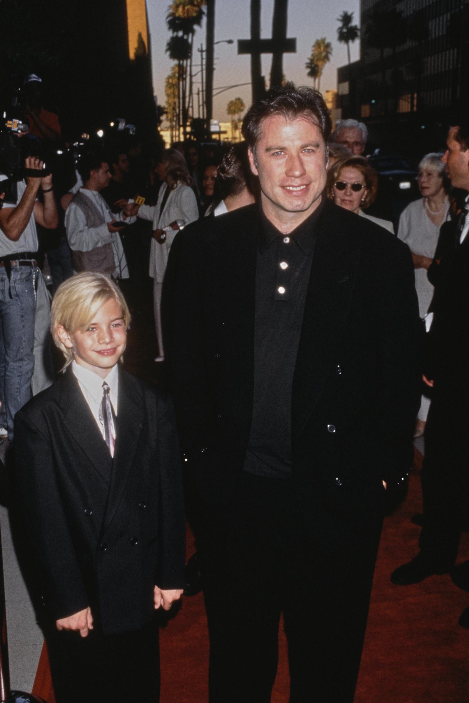 John Travolta with his son, Jett Travolta, at the premiere of "Phenomenon" on June 28, 1996, in Beverly Hills, California. | Source: Getty Images