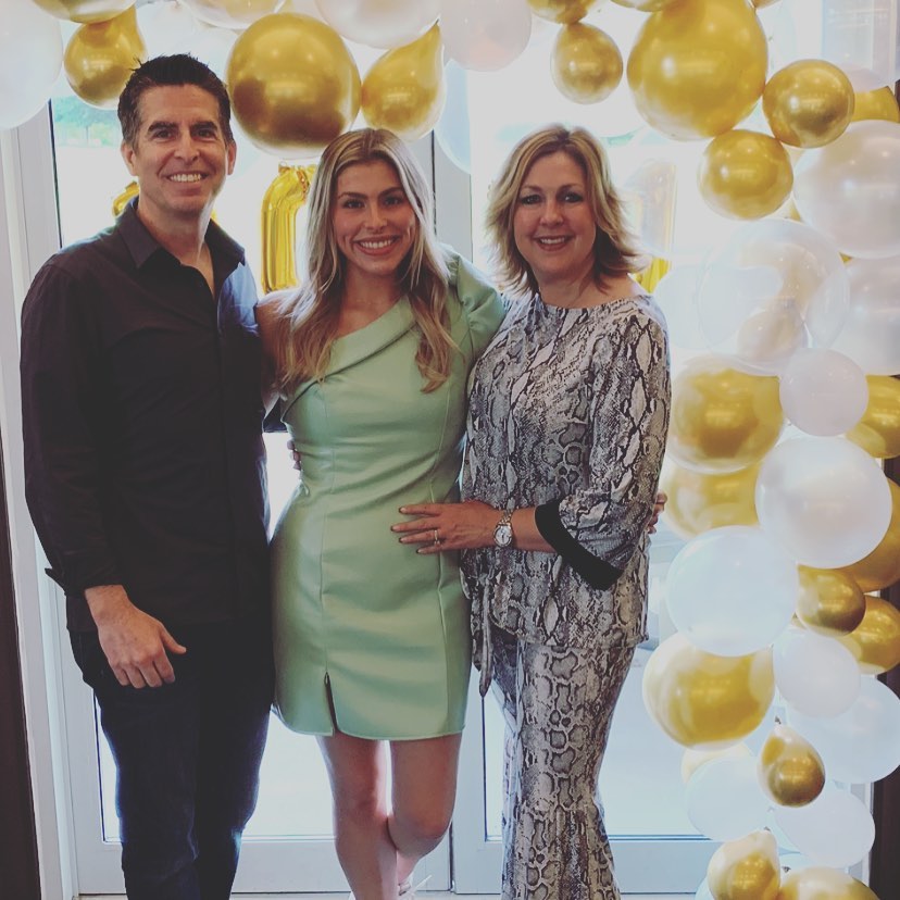 Rob and Julie Neal with their daughter from a post dated May 19, 2021. | Source: Instagram/julieneal05