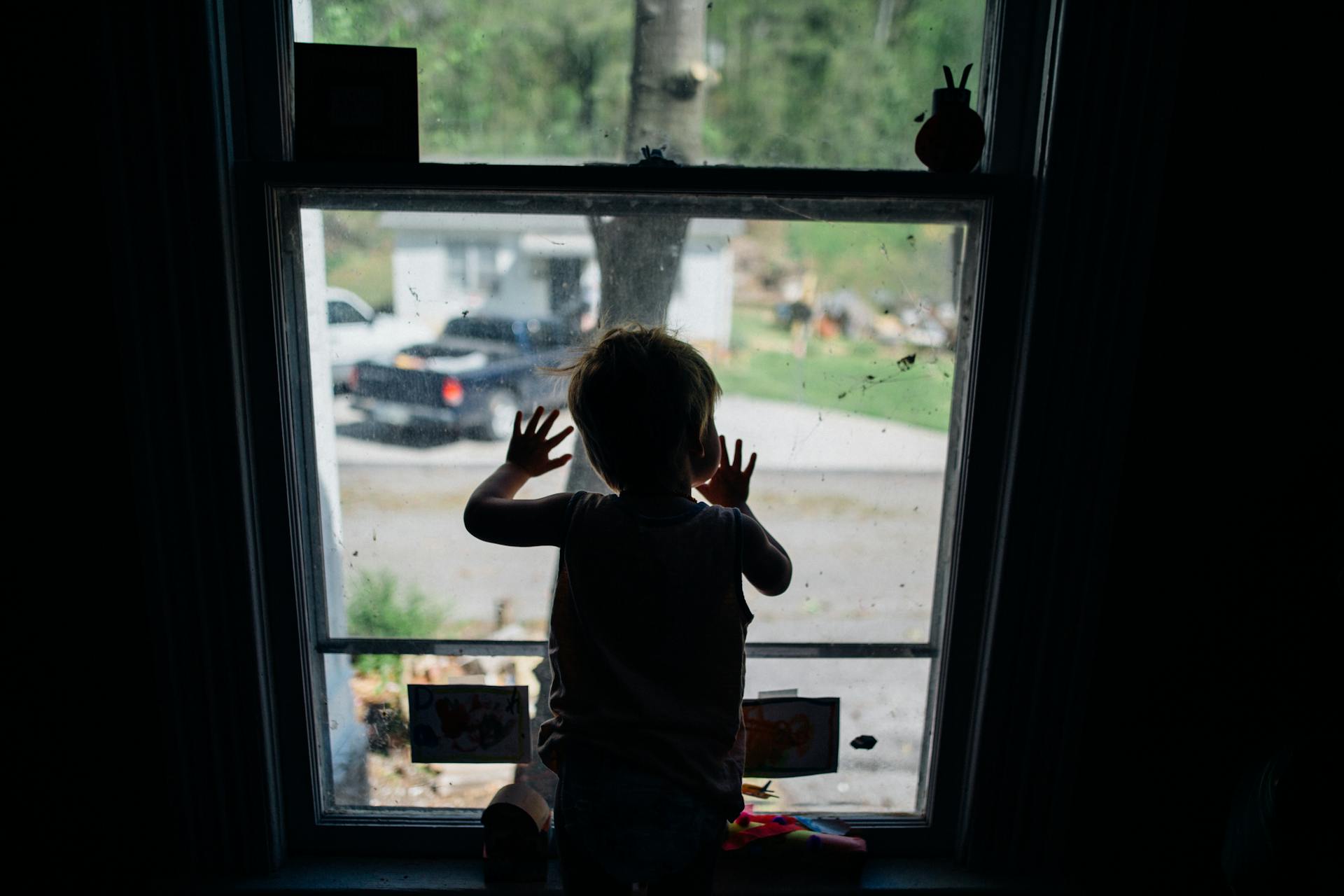 A child looking outside a window | Source: Pexels