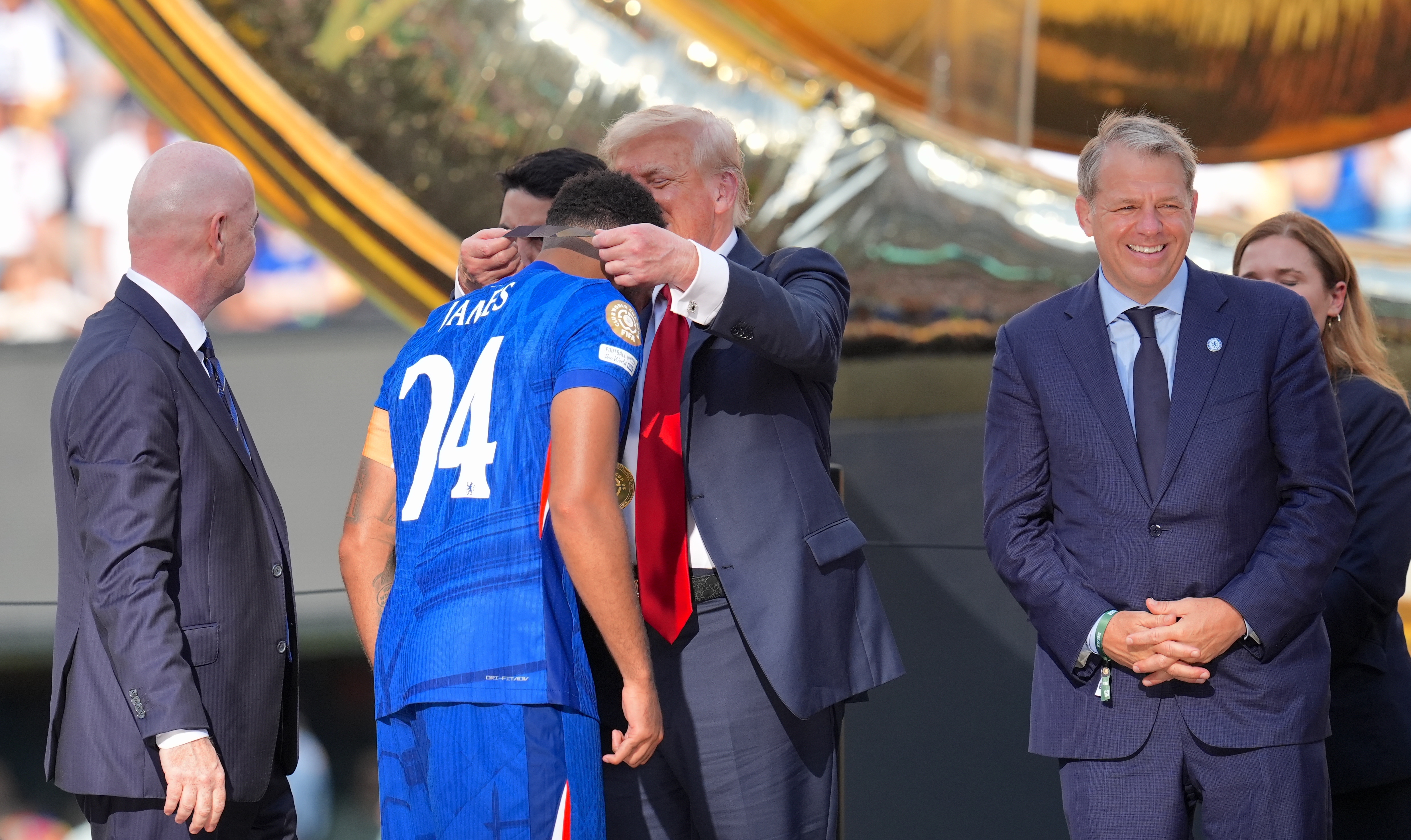 Donald Trump presenting a medal to Chelsea captain Reece James following the FIFA Club World Cup 2025 final match on July 13 in New Jersey. | Source: Getty Images