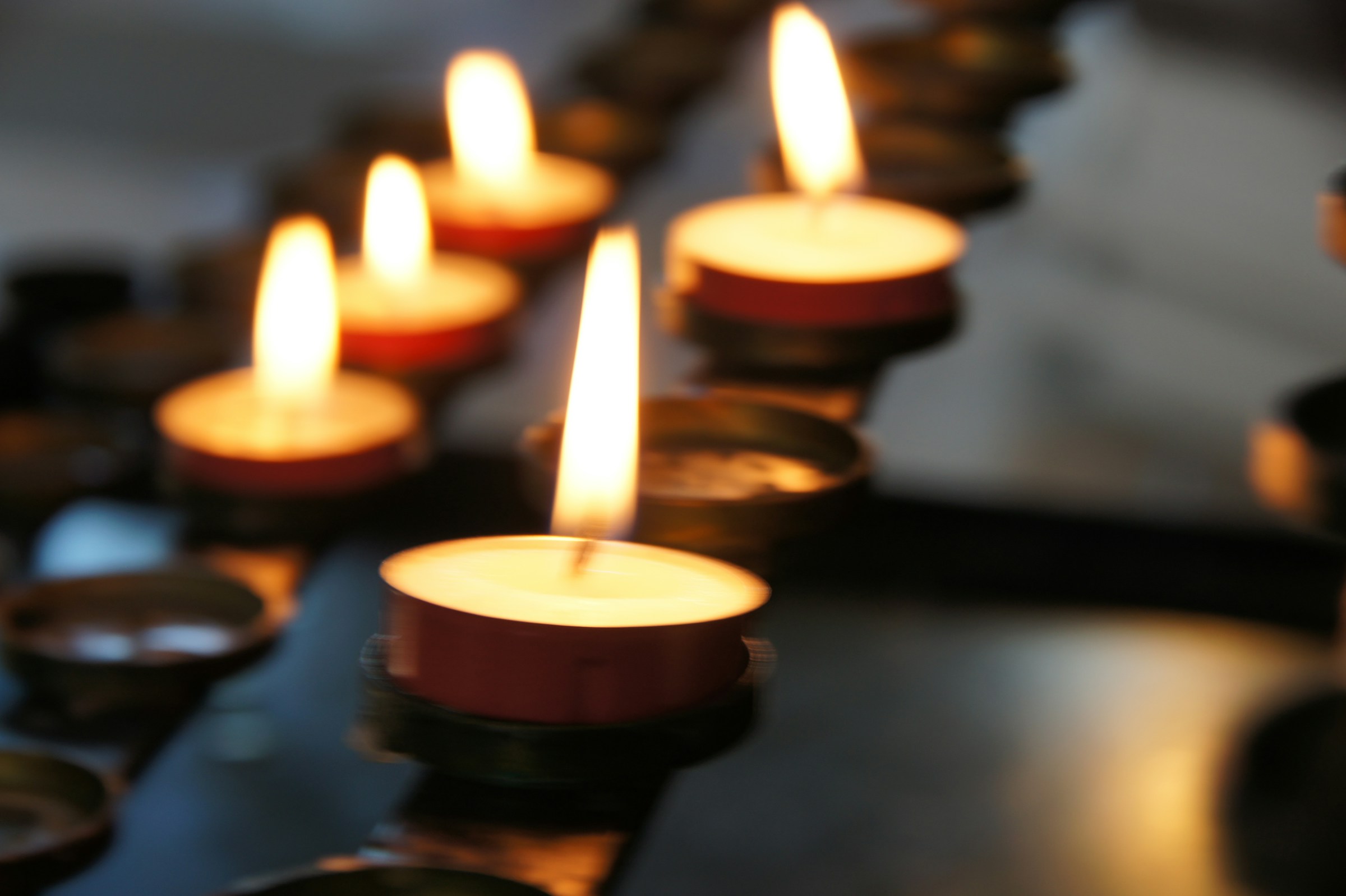Lit candles on a surface | Source: Unsplash