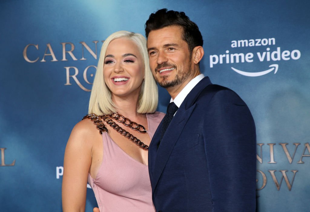 Katy Perry and her fiancée, Orlando Bloom pictured at  the LA premiere of Amazon's "Carnival Row" at TCL Chinese Theatre, 2019, California. | Photo: Getty Images 