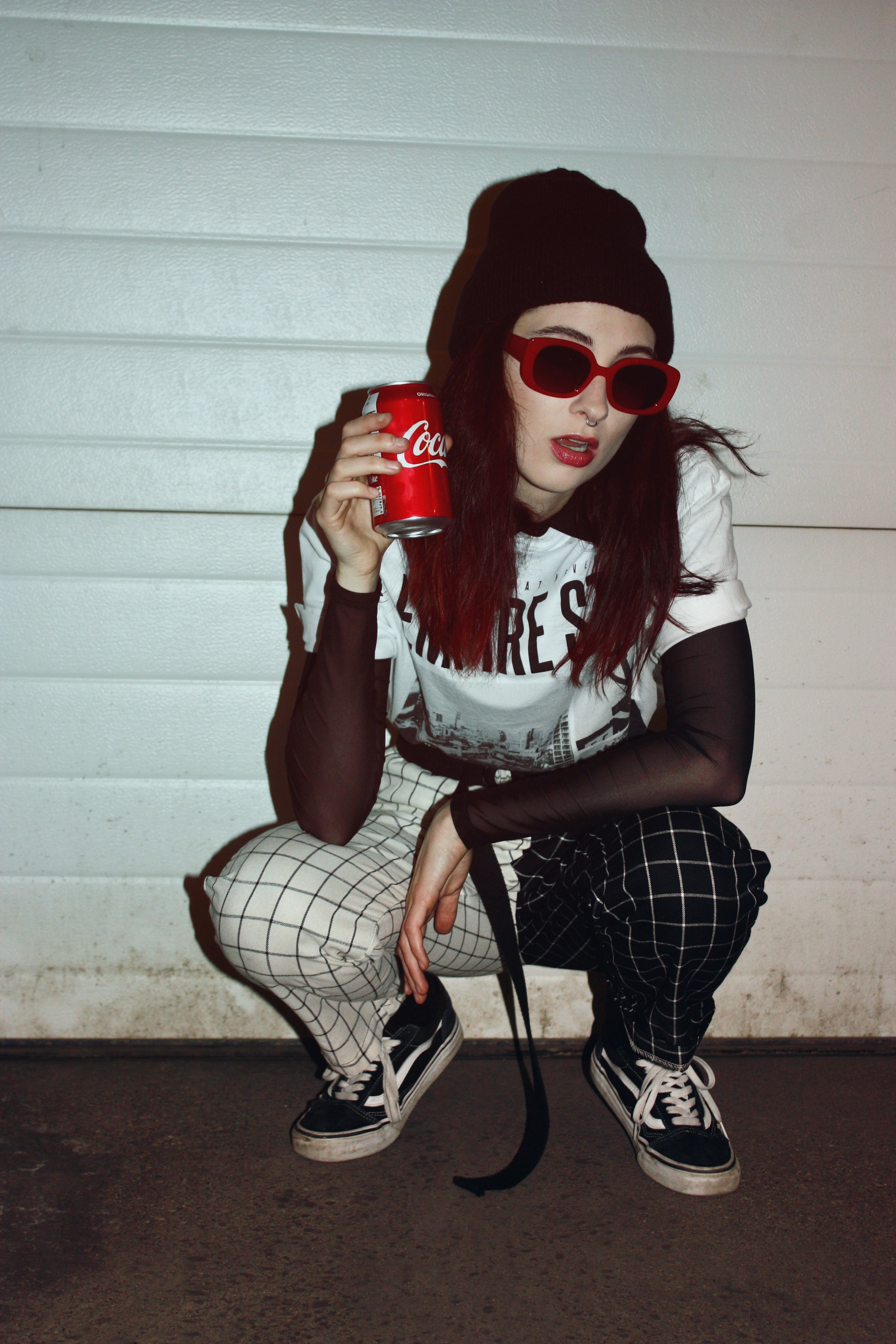 Woman holding a soft drink can | Source: Unsplash
