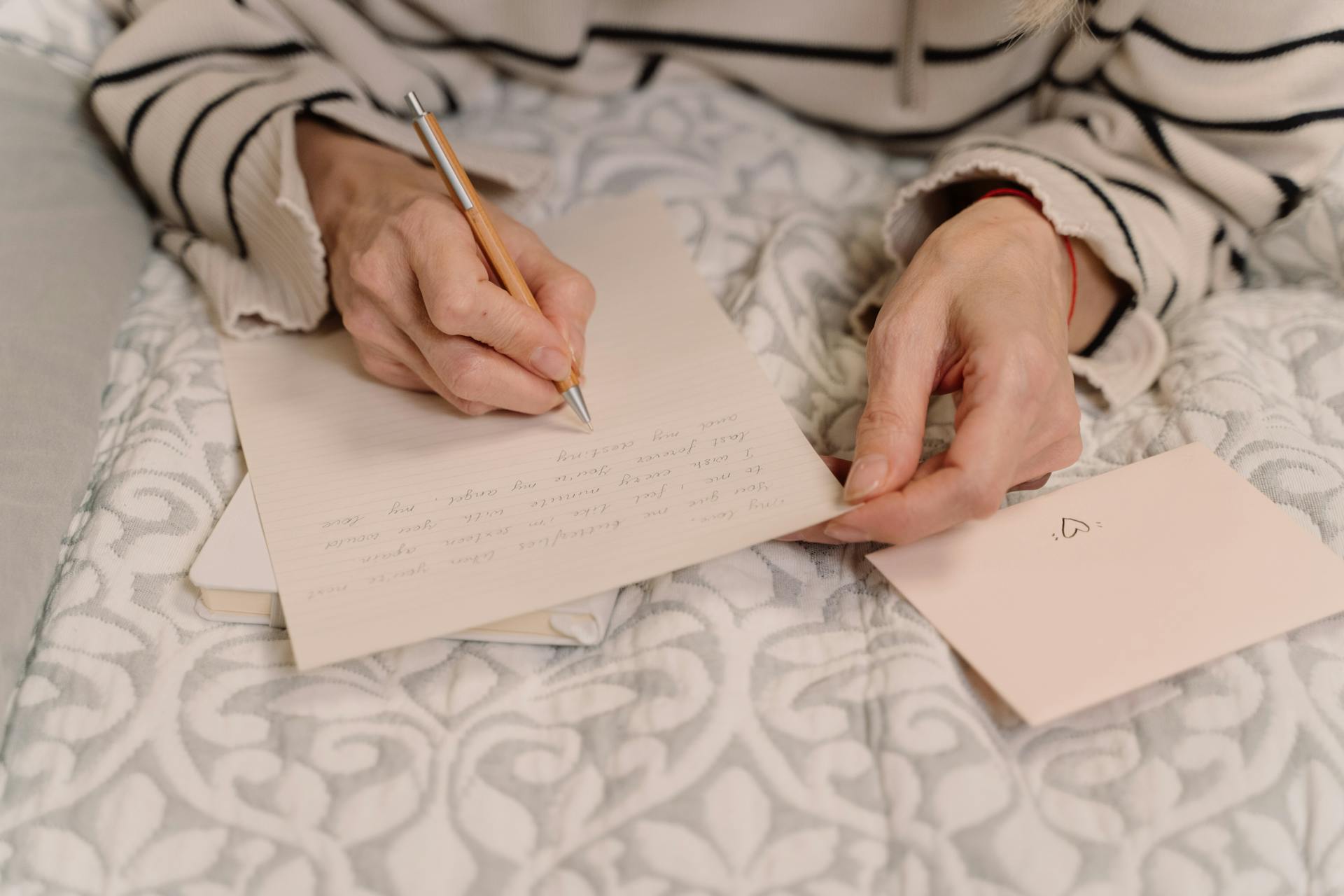 A closeup shot of a person writing a letter | Source: Pexels