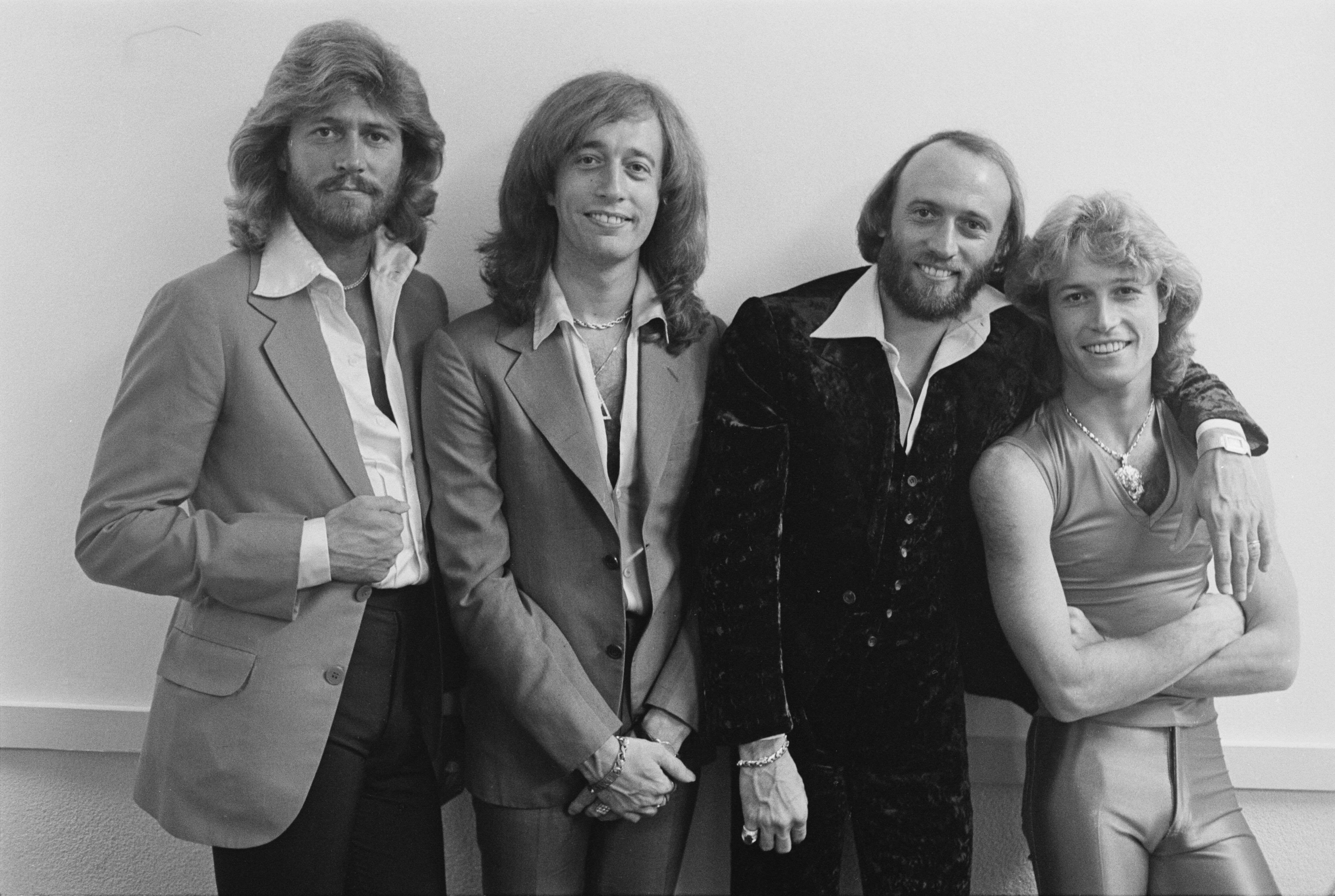 The Bee Gees and their younger brother Andy Gibb at the NARM convention and...