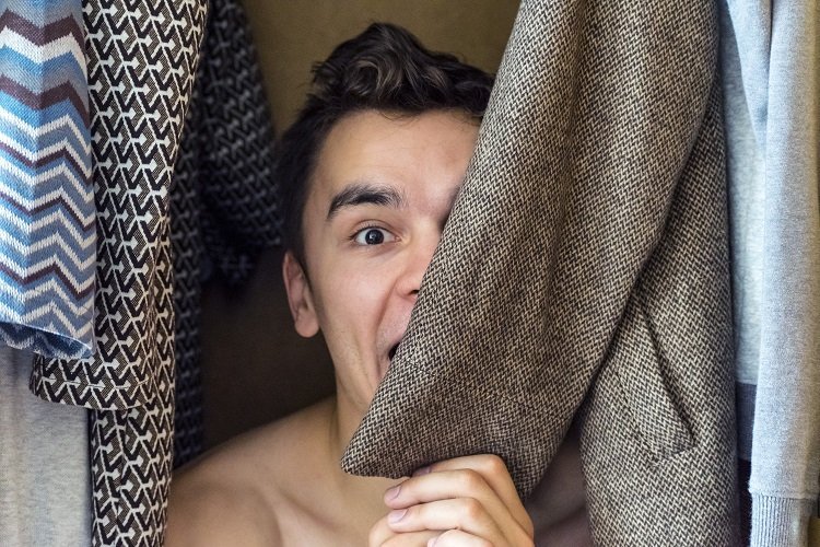 Man hiding in closet | Source: Shutterstock