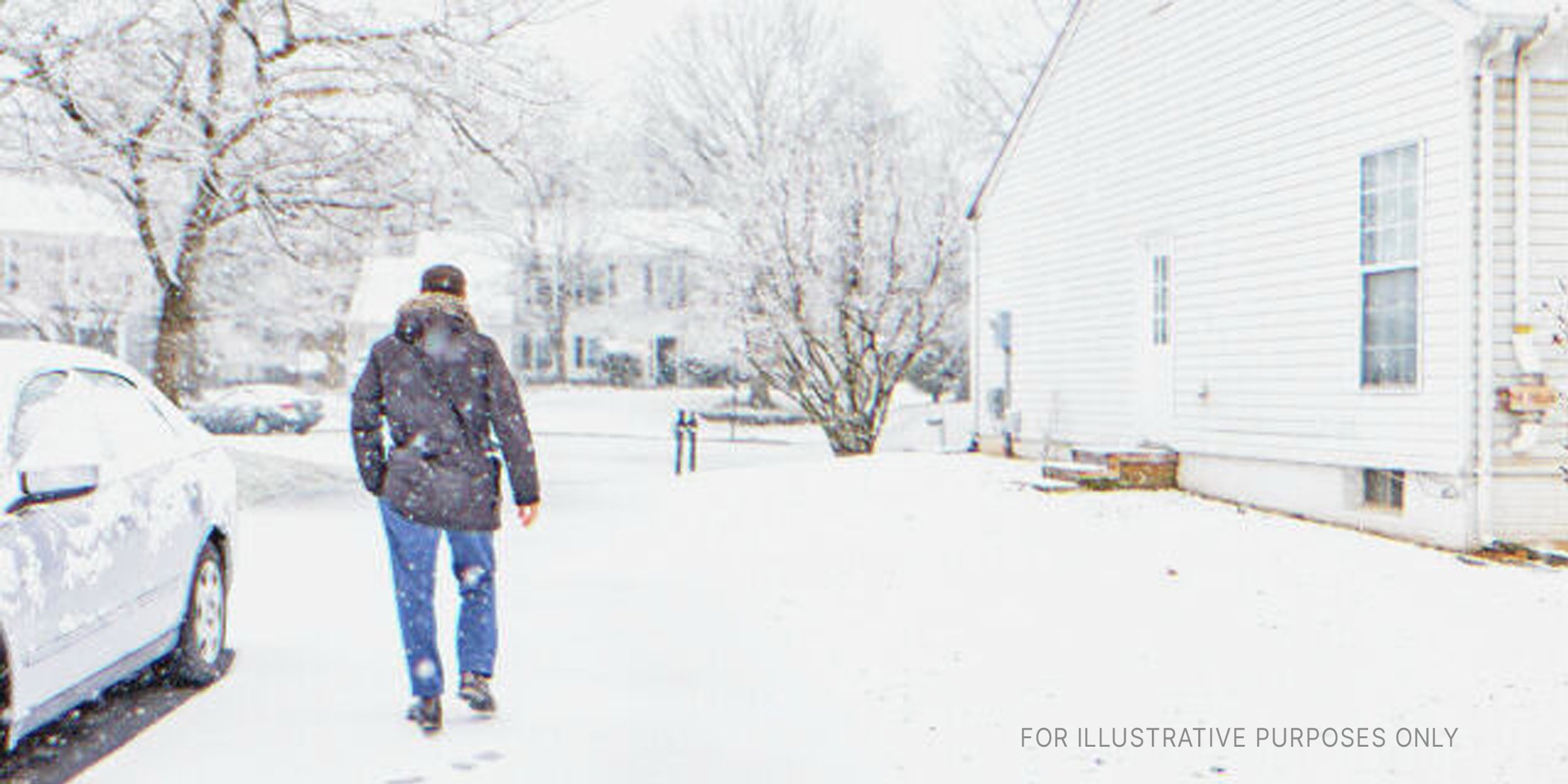 Man Walking In Snowy Weather. | Source: Shutterstock