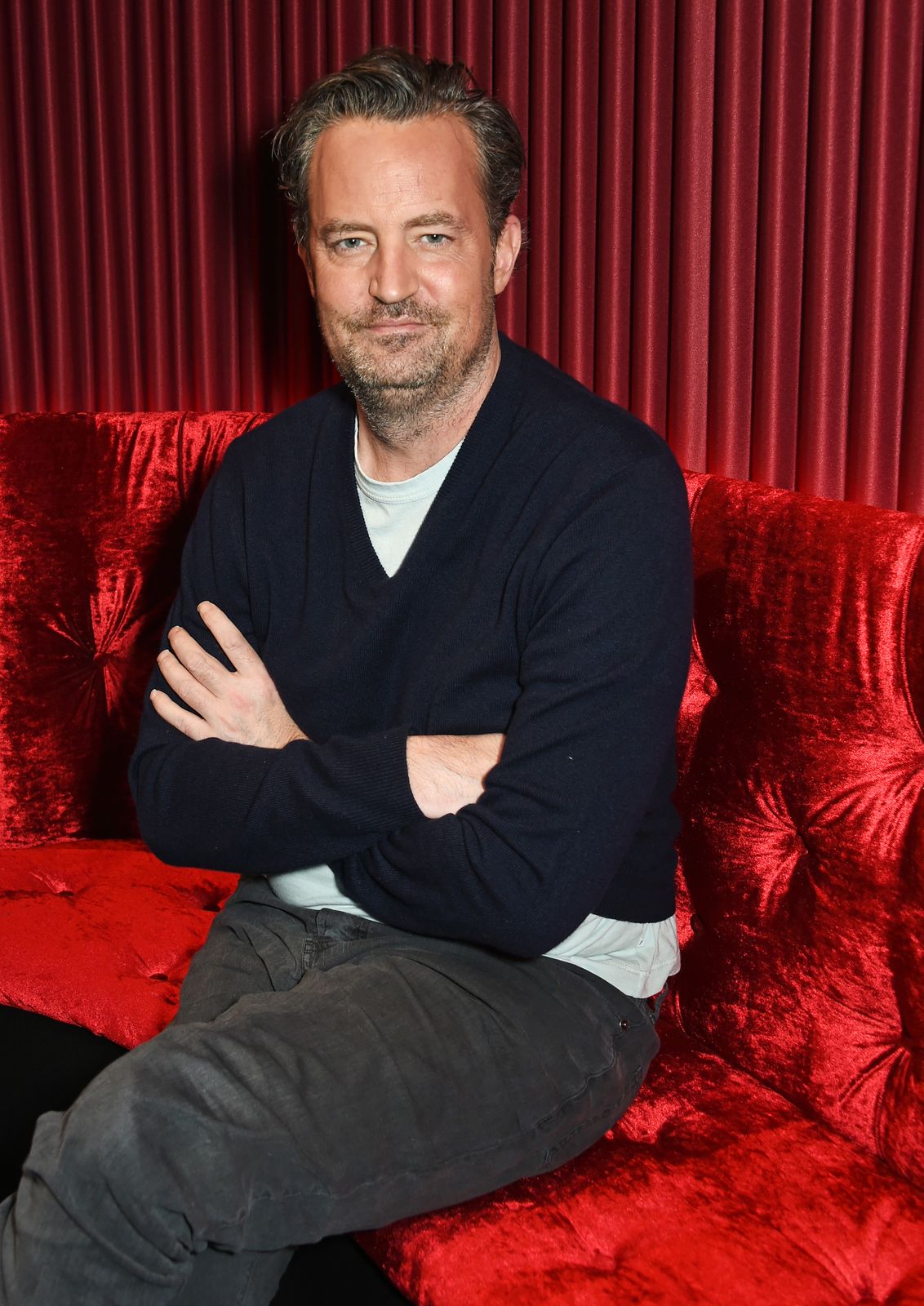 Matthew Perry poses at a photocall for the play "The End Of Longing" on February 8, 2016, in London, England | Photo: David M. Benett/Dave Benett/Getty Images
