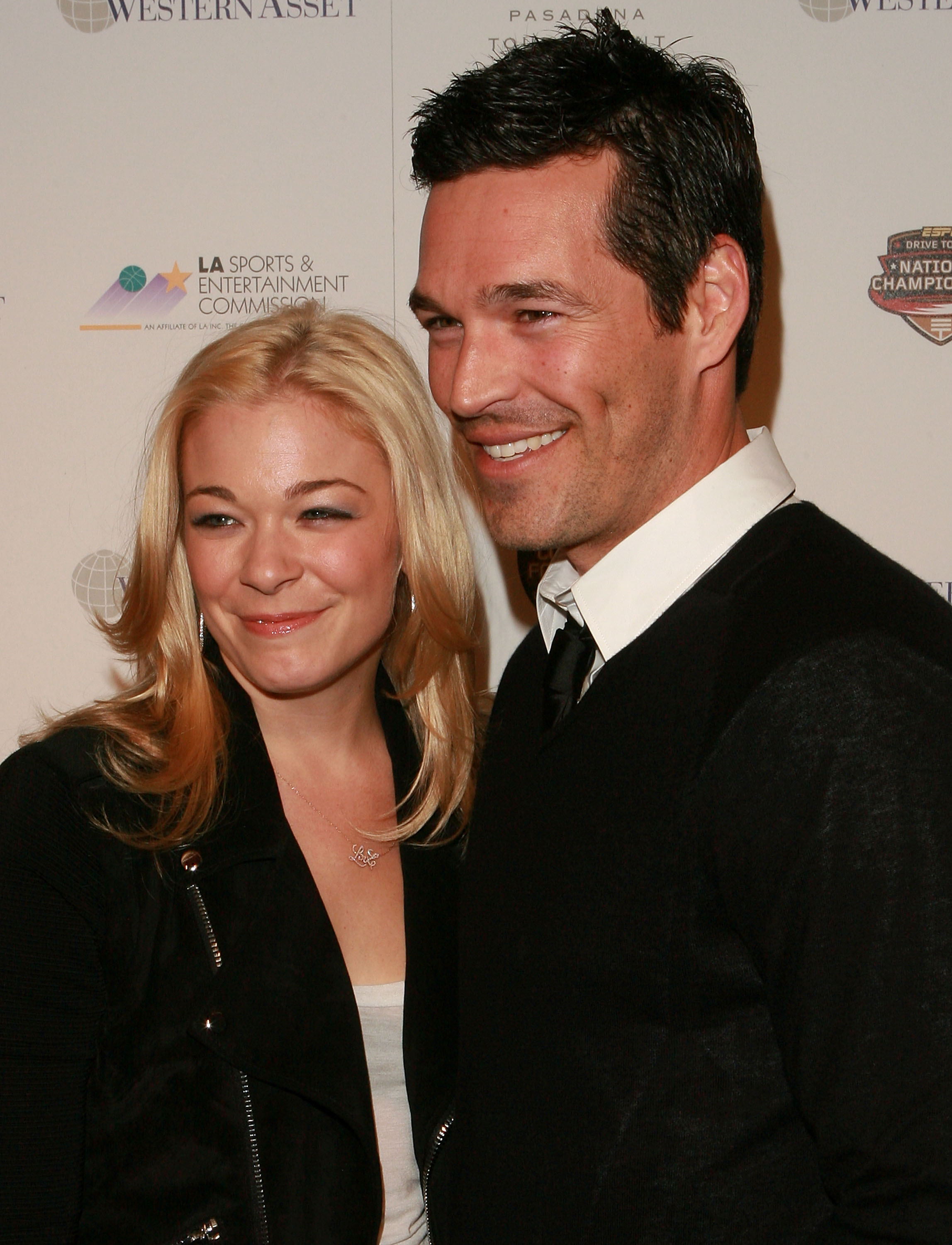 LeAnn Rimes and Eddie Cibrian arrive at the 2010 Official BCS National Championship Party on January 6, 2010, at the Pasadena Convention Center in Pasadena, California | Source: Getty Images