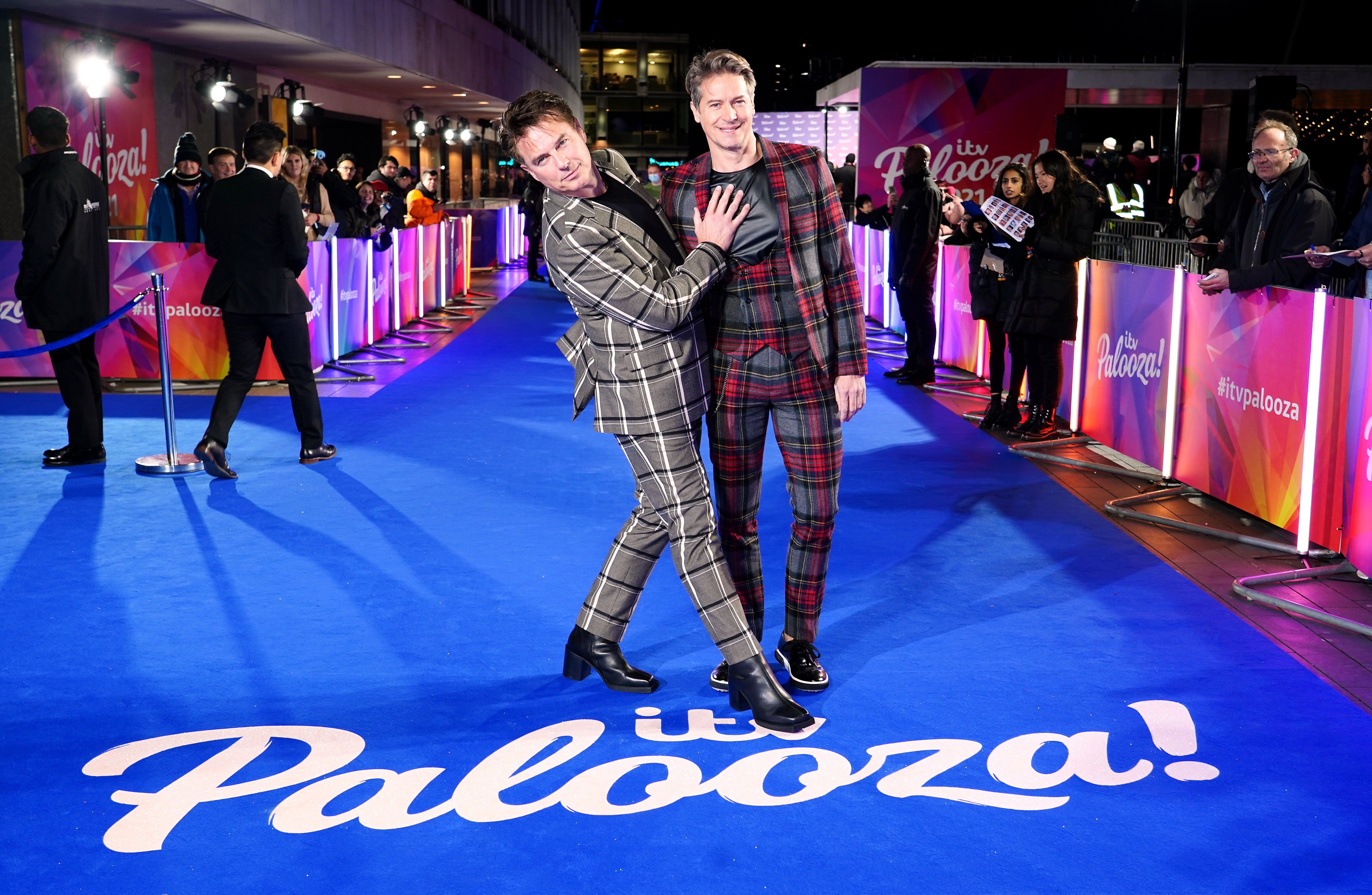 John Barrowman and Scott Gill (right) attending the ITV Palooza held at the Royal Festival Hall, Southbank Centre, London, on November 23, 2021. | Source: Getty Images