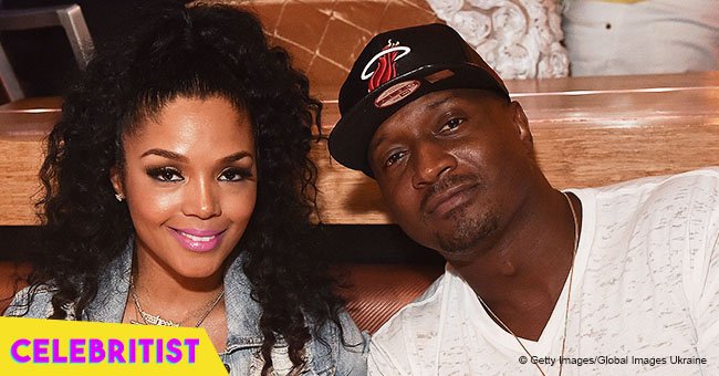 Rasheeda Frost looks confident with blond hair, wearing pink blouse & ripped jeans in new pic