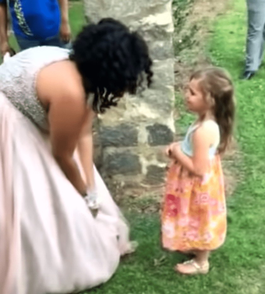 Teen welcomes the attention of a little girl who thinks she is a princess. | Source: youtube.com/Inside Edition