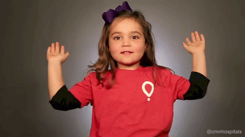 A little girl with her hands in the air | Source: Giphy