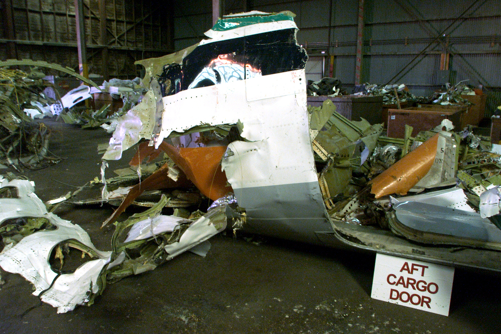The cargo door section is shown at a warehouse at NBVC (Naval Base Ventura County) Port Hueneme which contains about 85% of the wreckage of the Alaska Airlines plane that crashed off Ventura County coast. | Source: Getty Images
