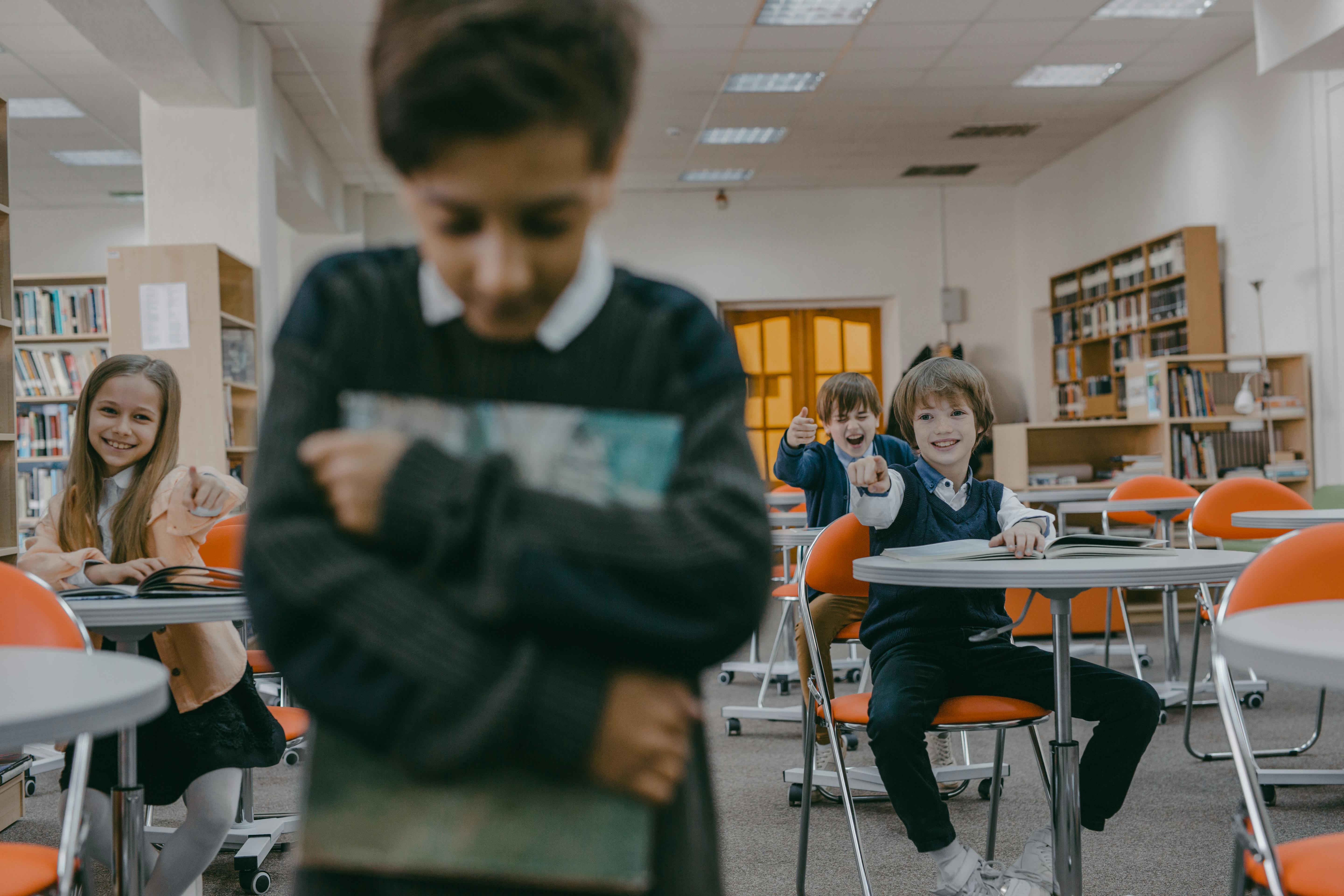 A kid being laughed at by other students | Source: Pexels