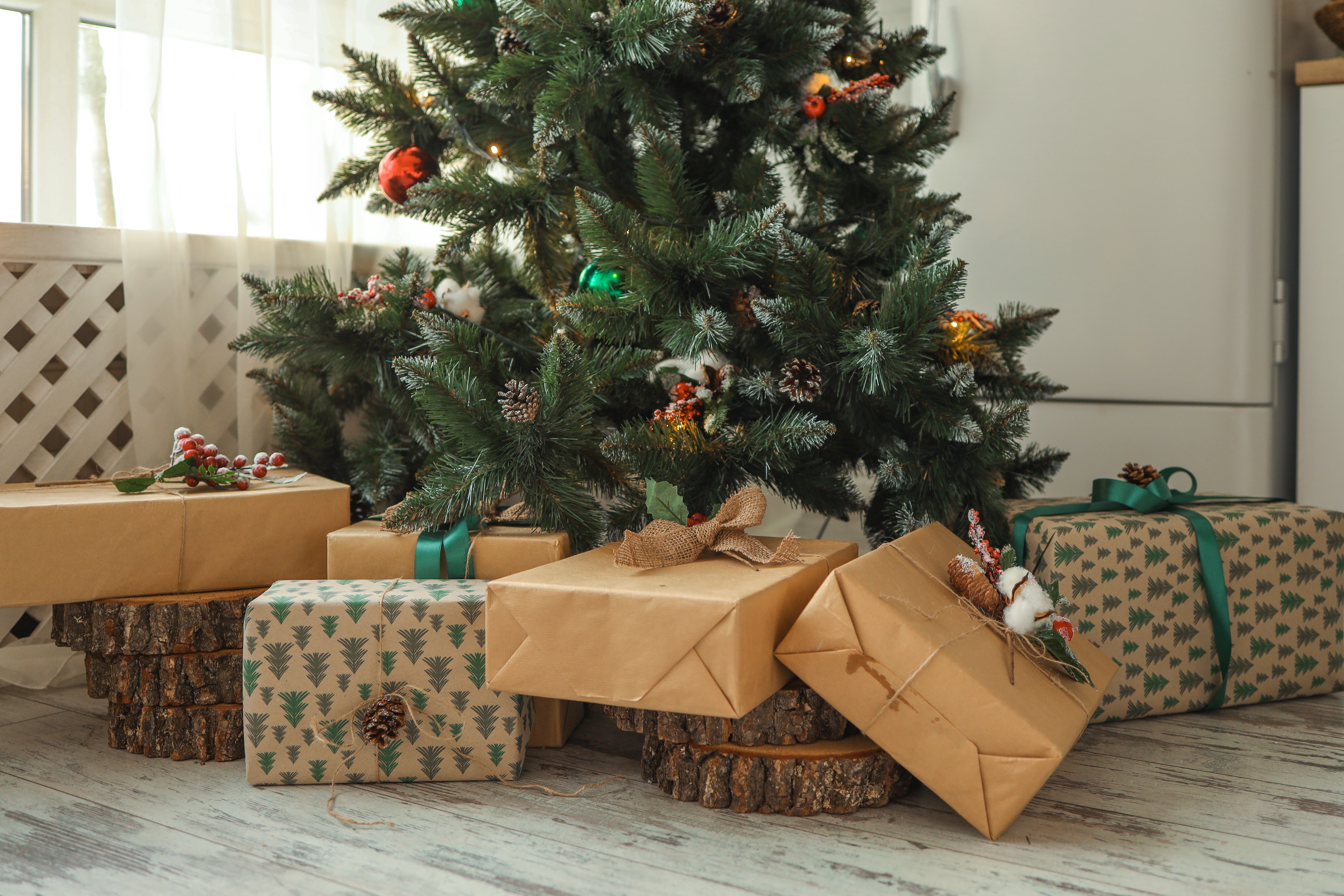 A Christmas tree with present under it | Source: Shutterstock